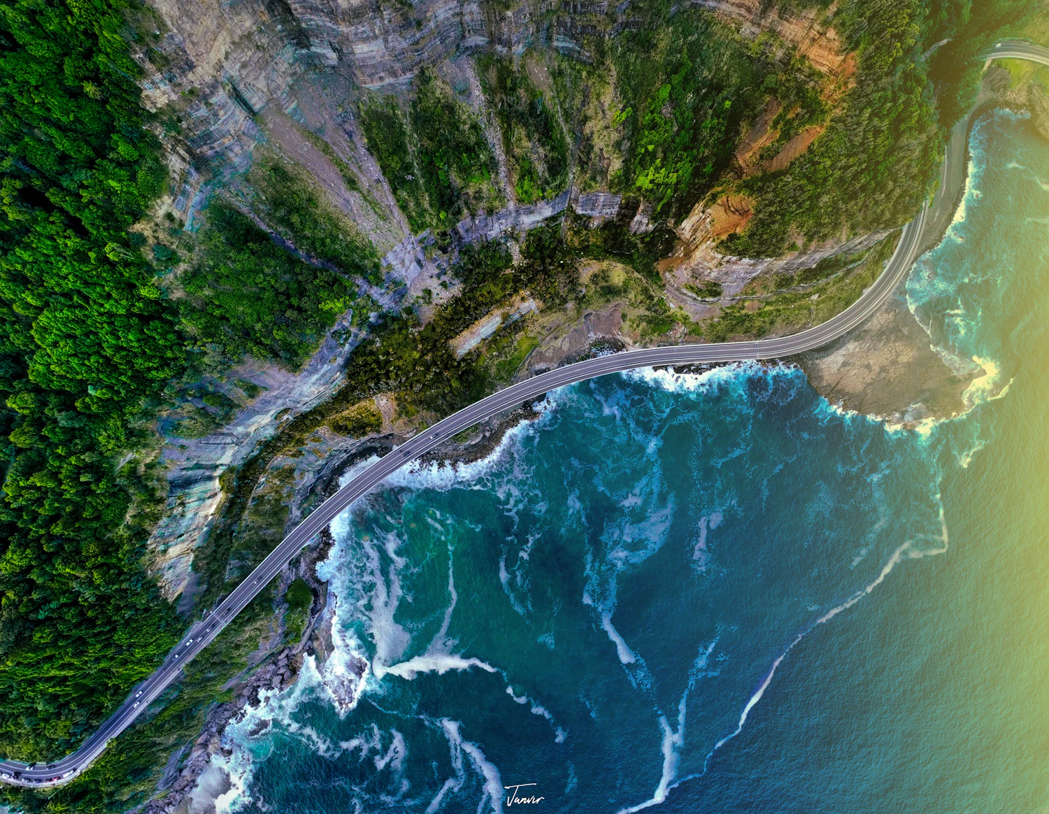 An aerial view of a winding coastal road