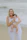 Woman holding a baby on a beach
