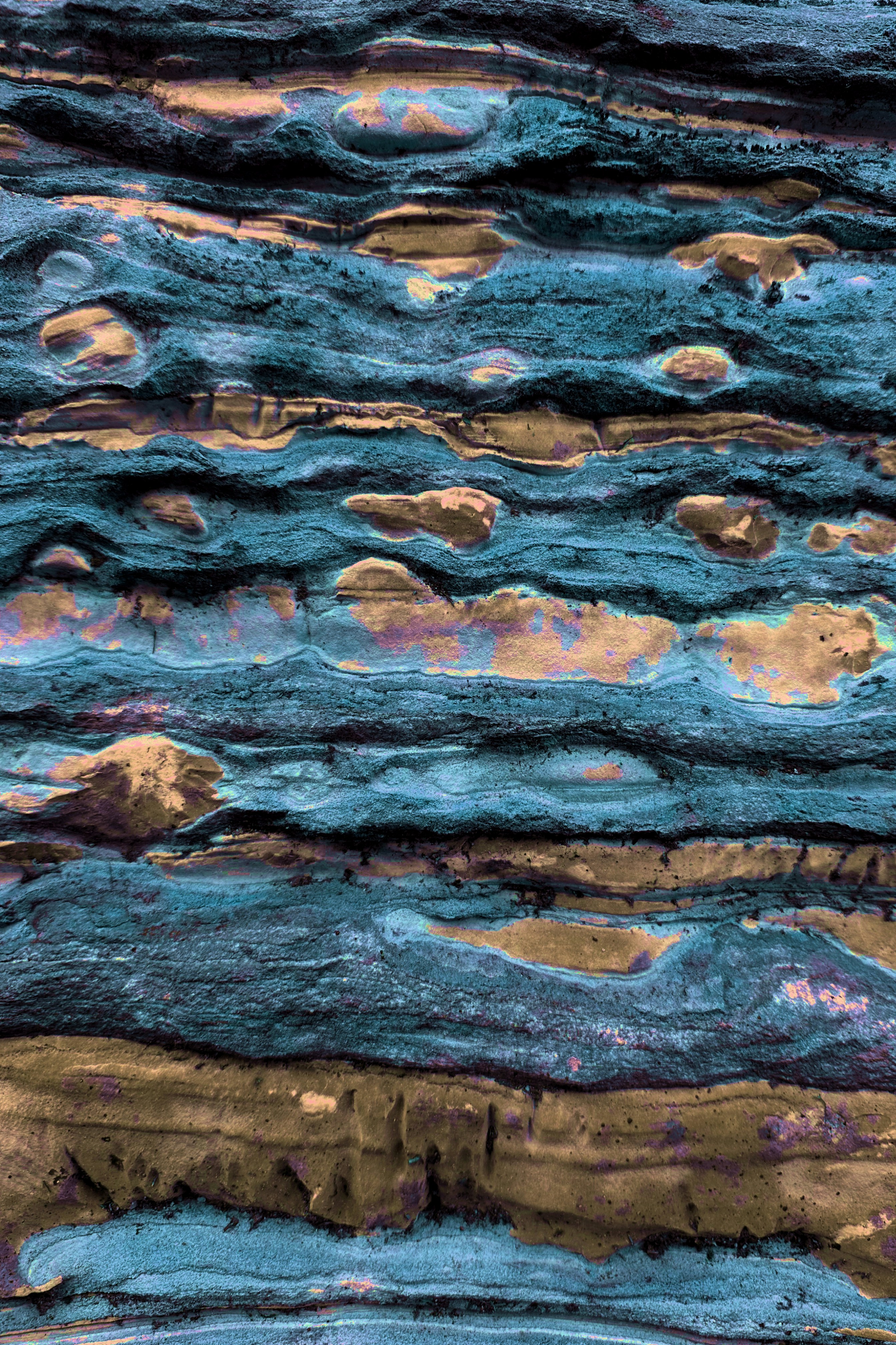 Abstract textured background of blue and gold layers.