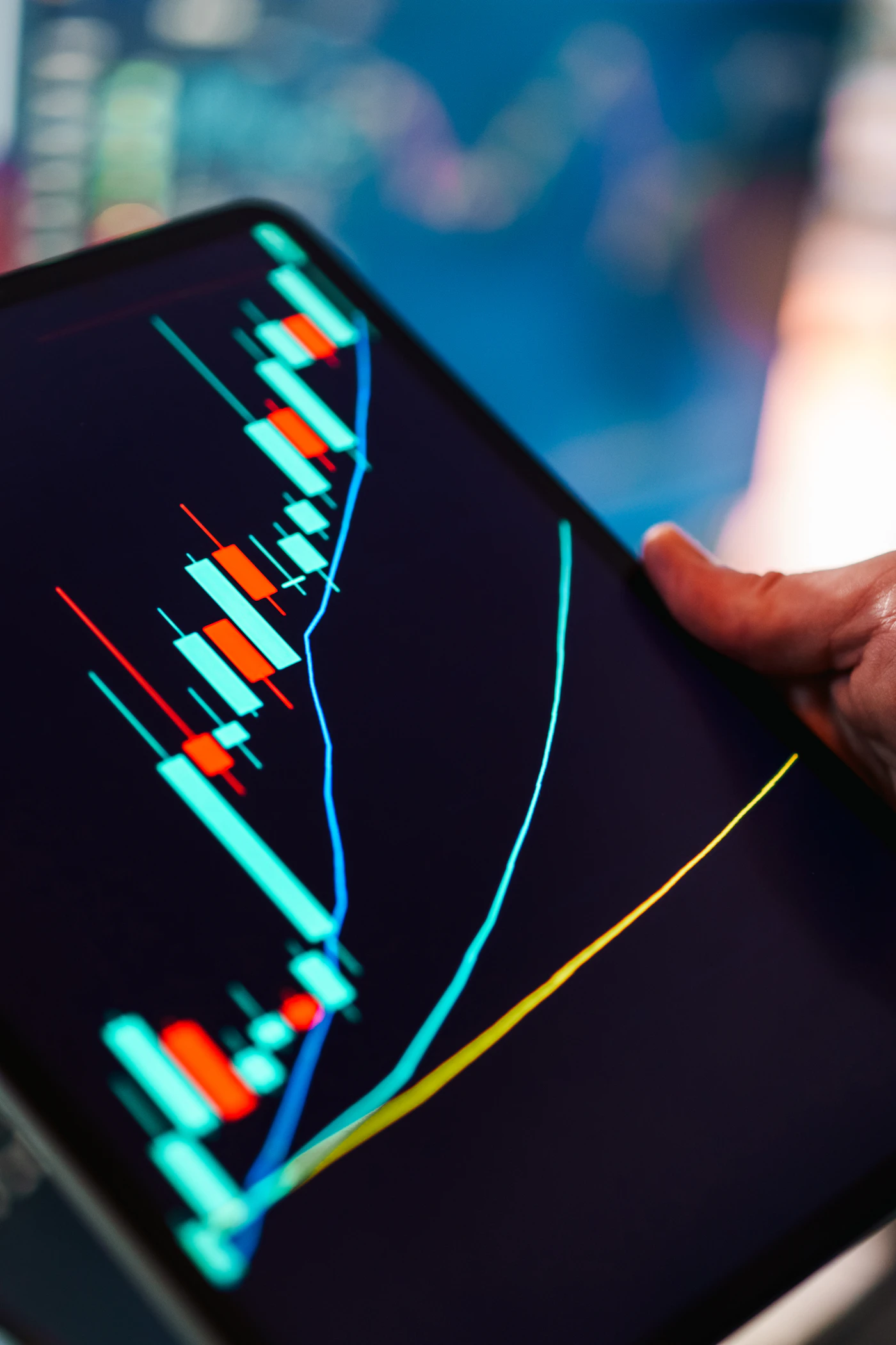 Modern tablet displaying candlestick charts for options futures and derivatives market analysis