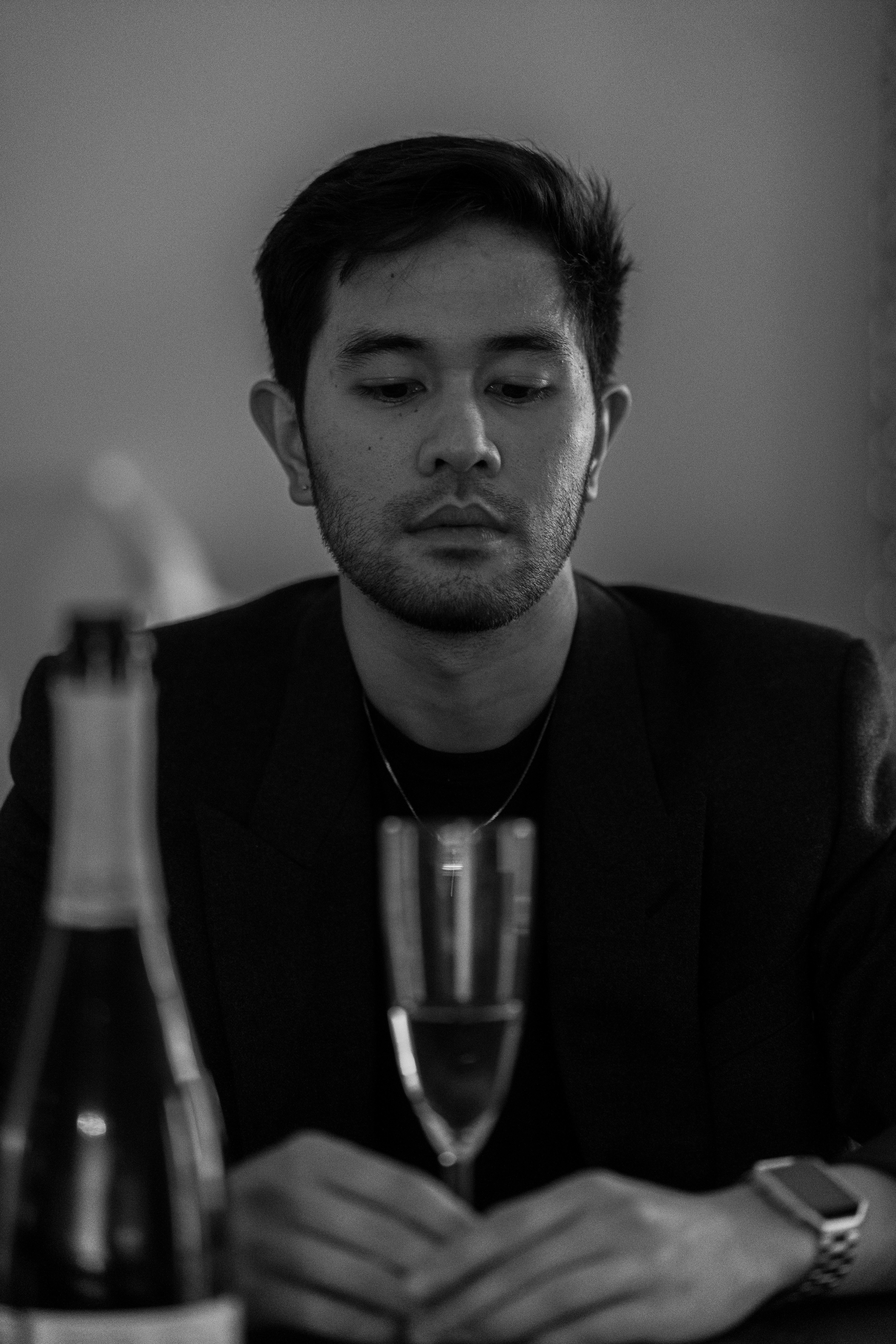 Man in suit with champagne glass and bottle