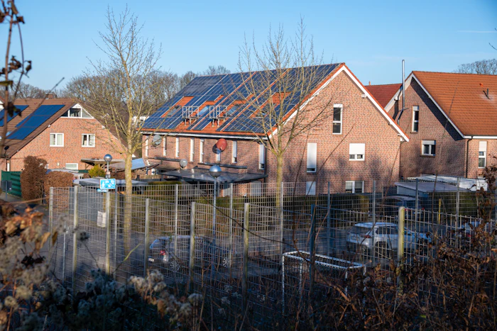 Brick houses with solar panels on the roof