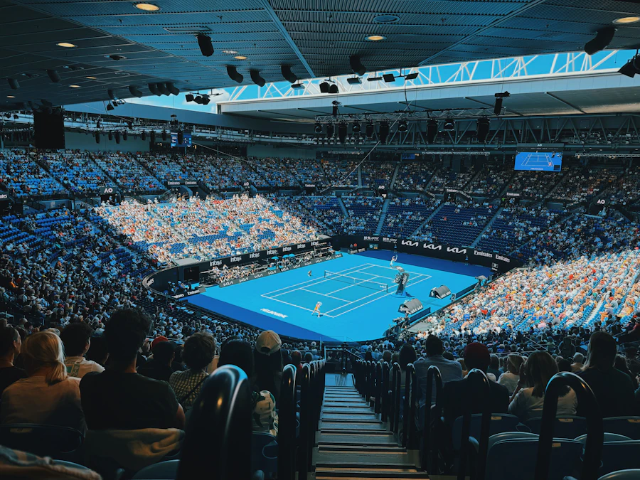 A packed tennis stadium during a match