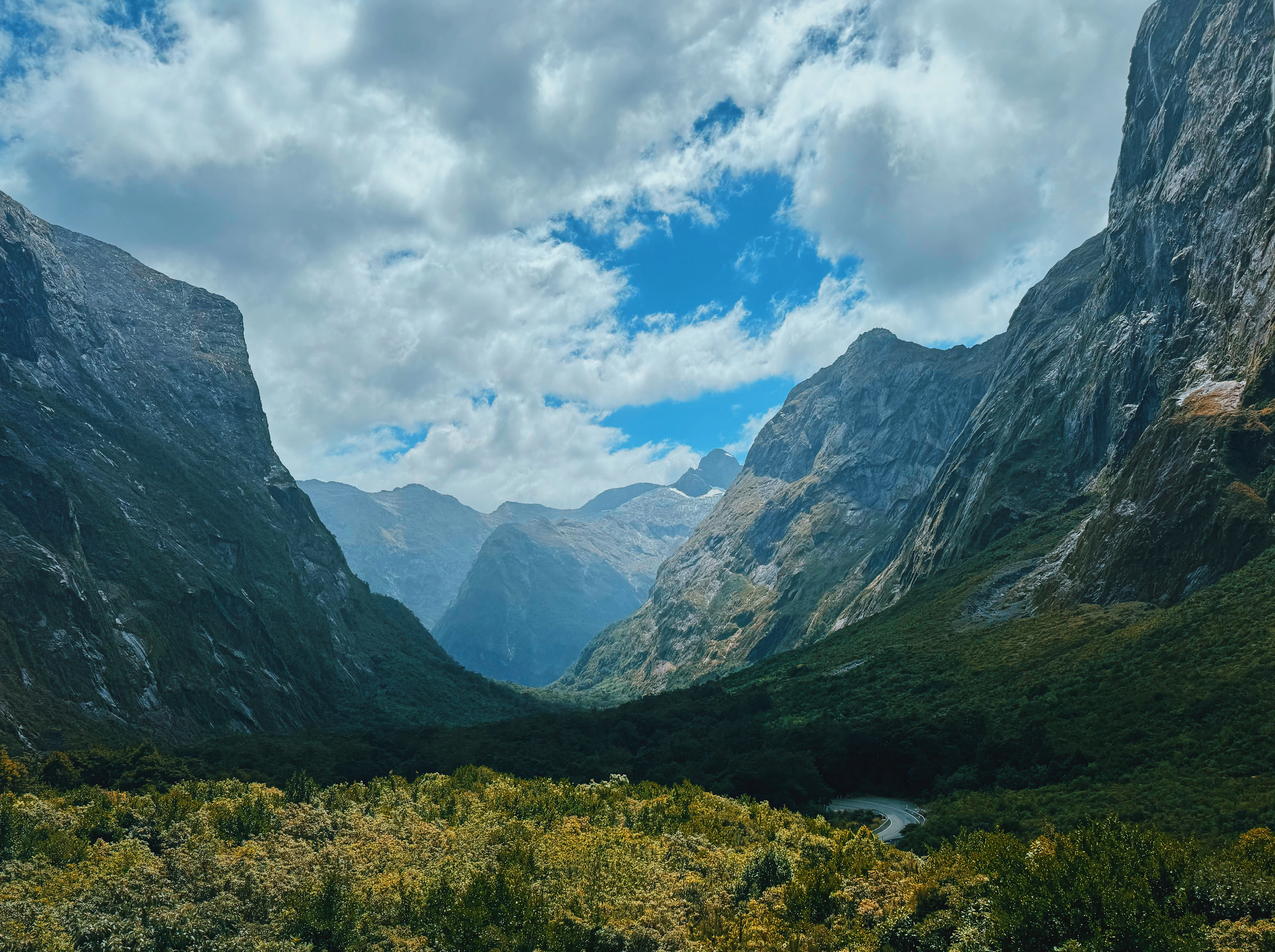 A deep glacial valley between steep granite walls, seen from the Milford Track