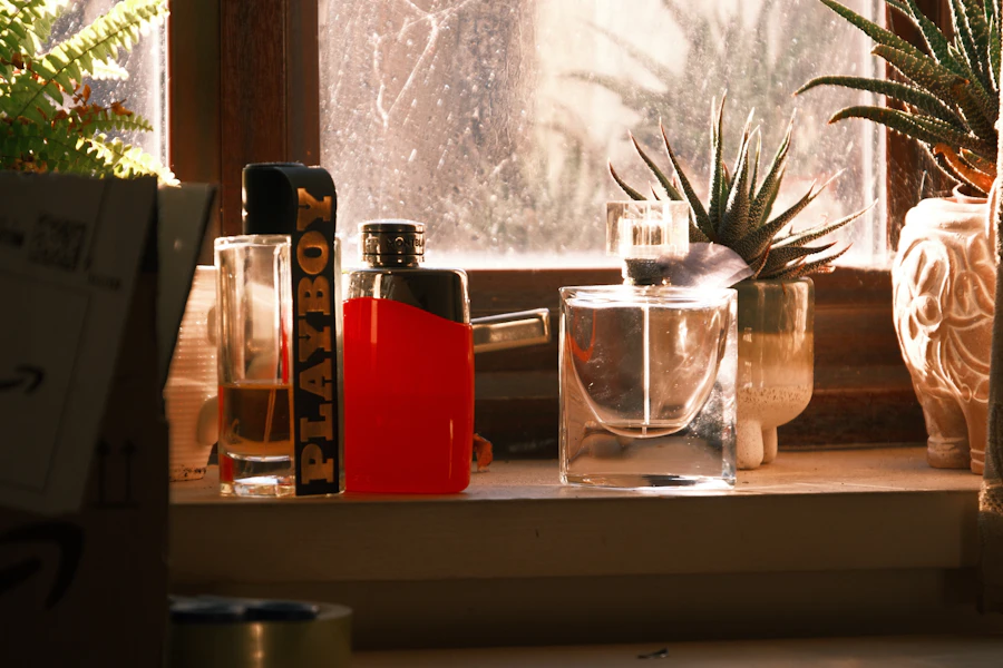 Red lighter and glasses on a windowsill