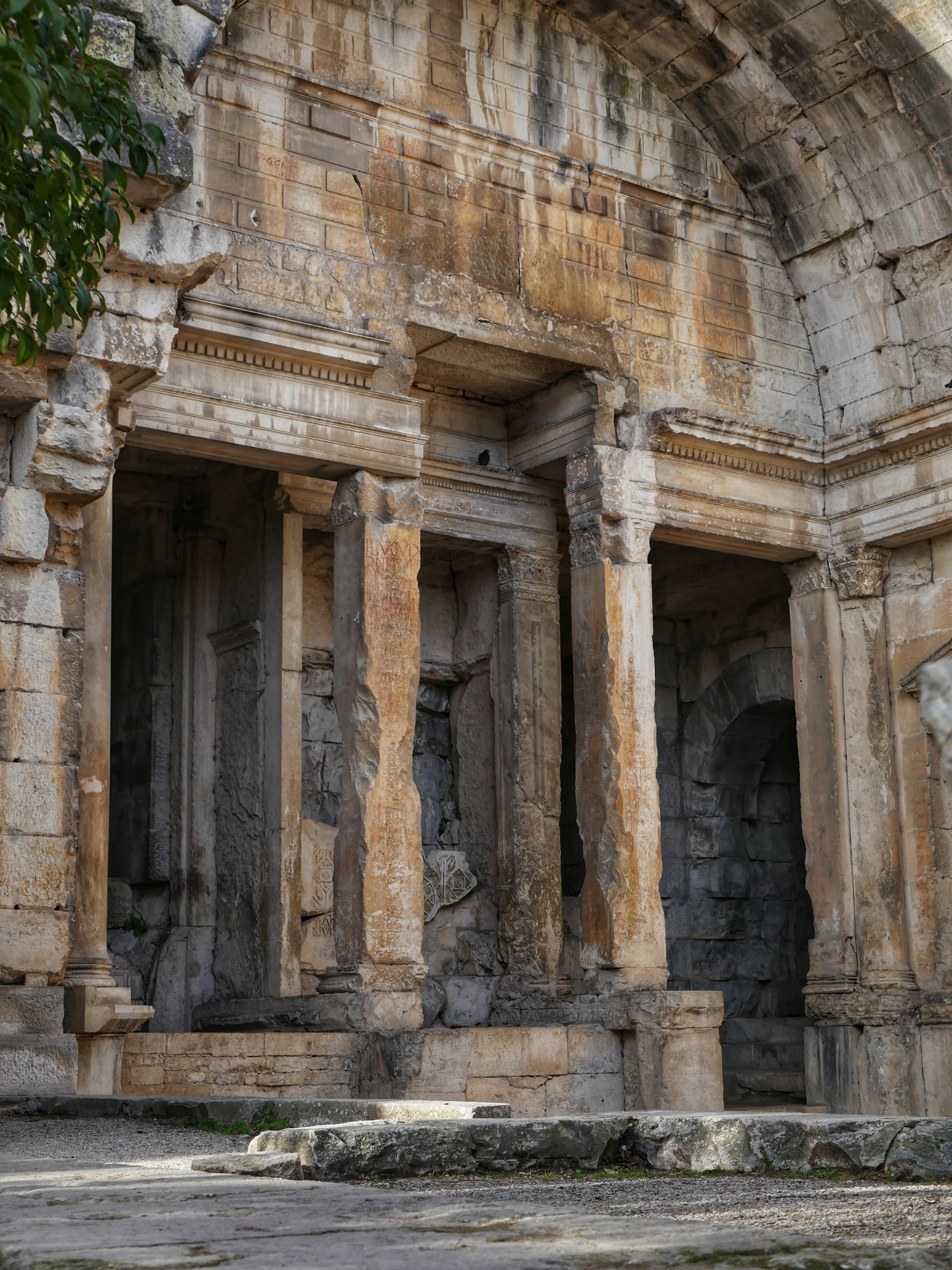 Ancient stone ruins with weathered columns and arches.