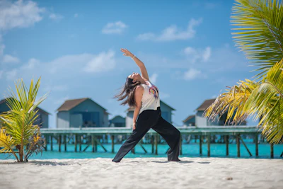 Woman yoga on beach