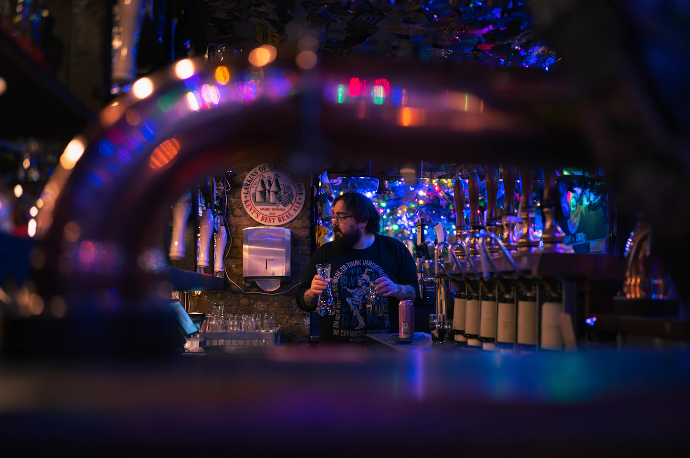 Bartender working behind a busy bar