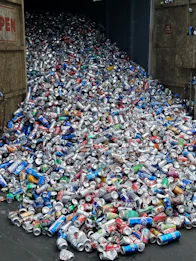 A large pile of crushed aluminum cans