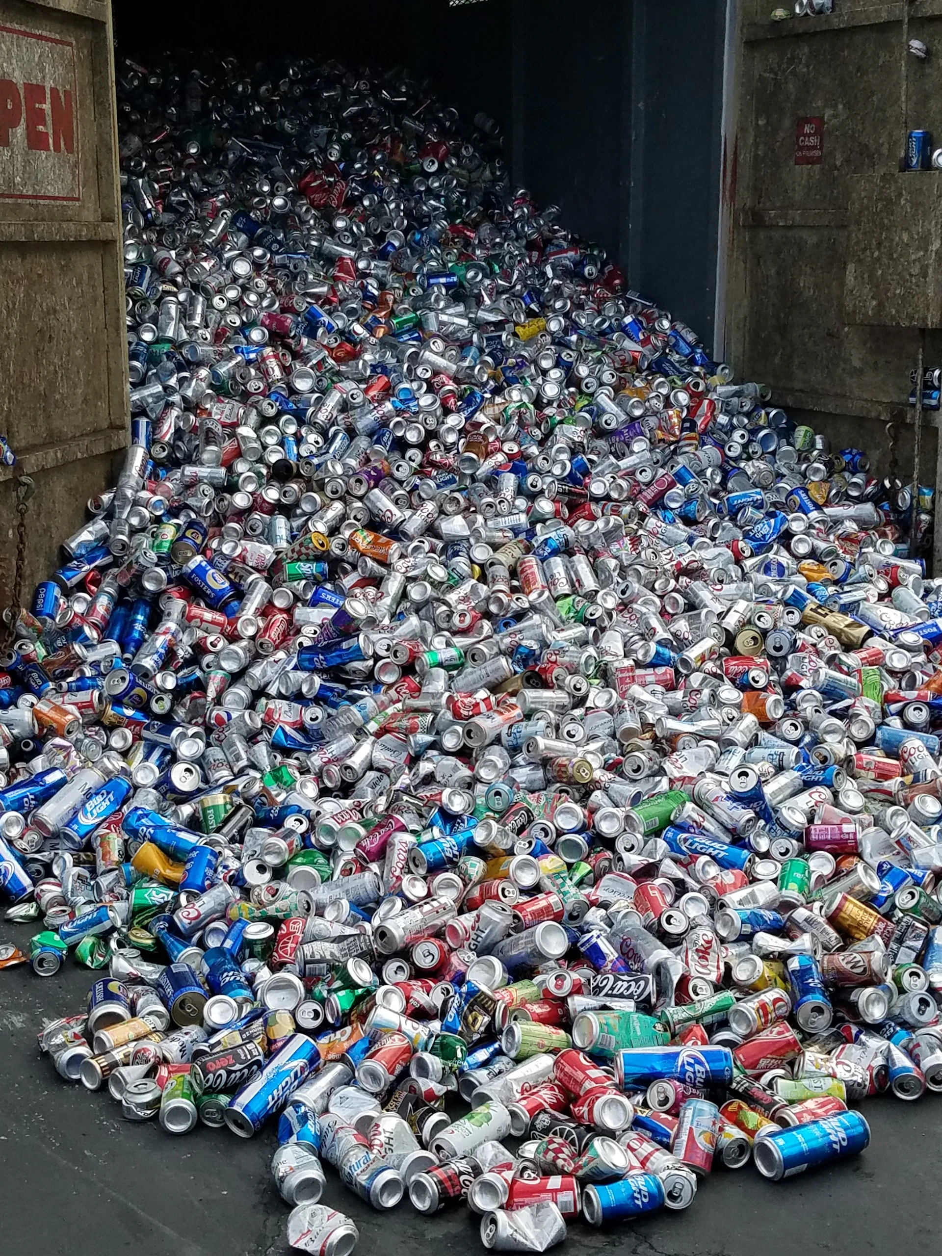 A large pile of crushed aluminum cans