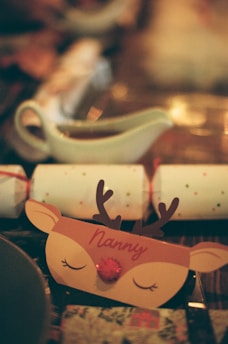 Christmas cracker with reindeer design and 'nanny' name
