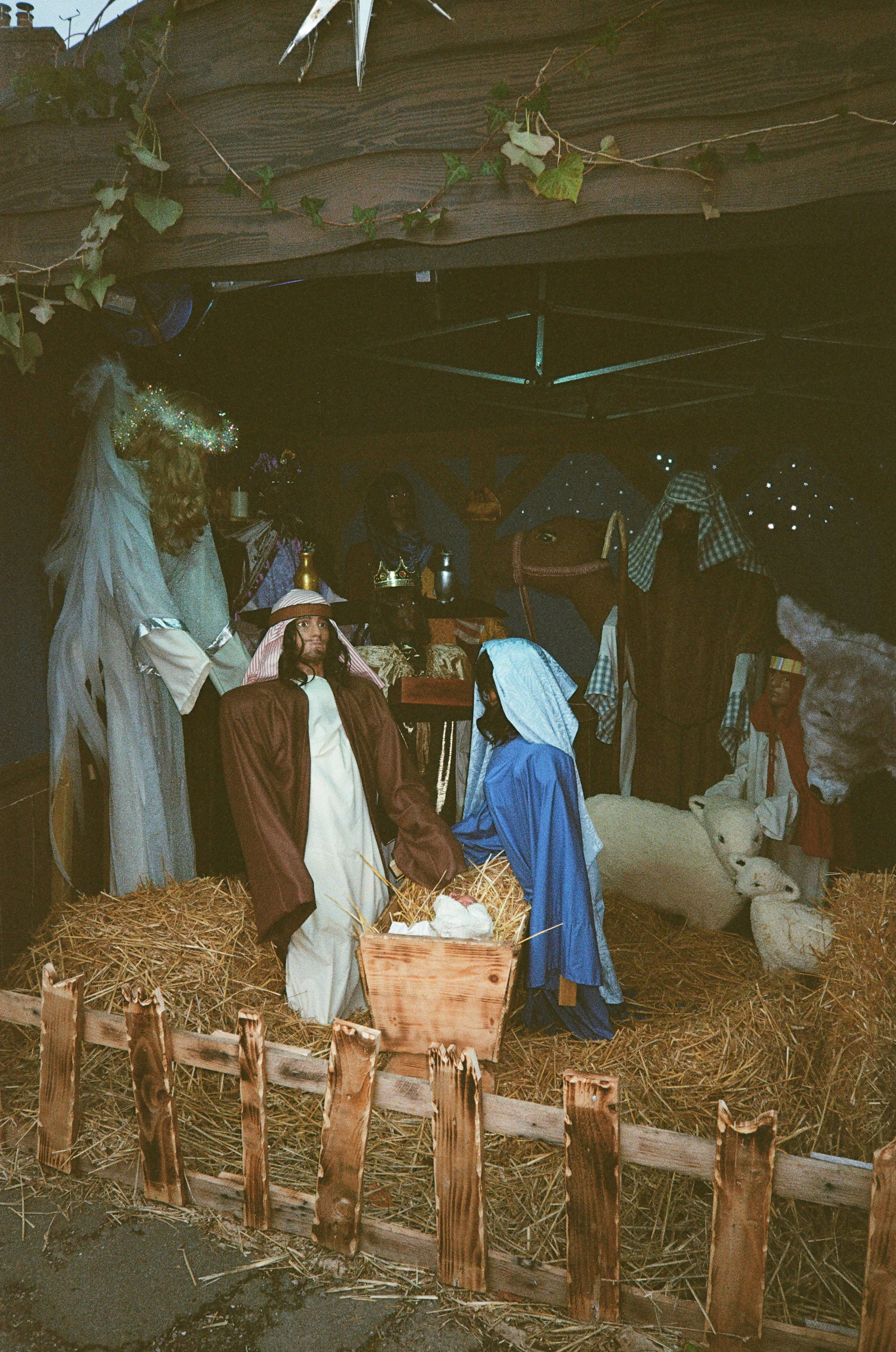 Nativity scene with figures on hay