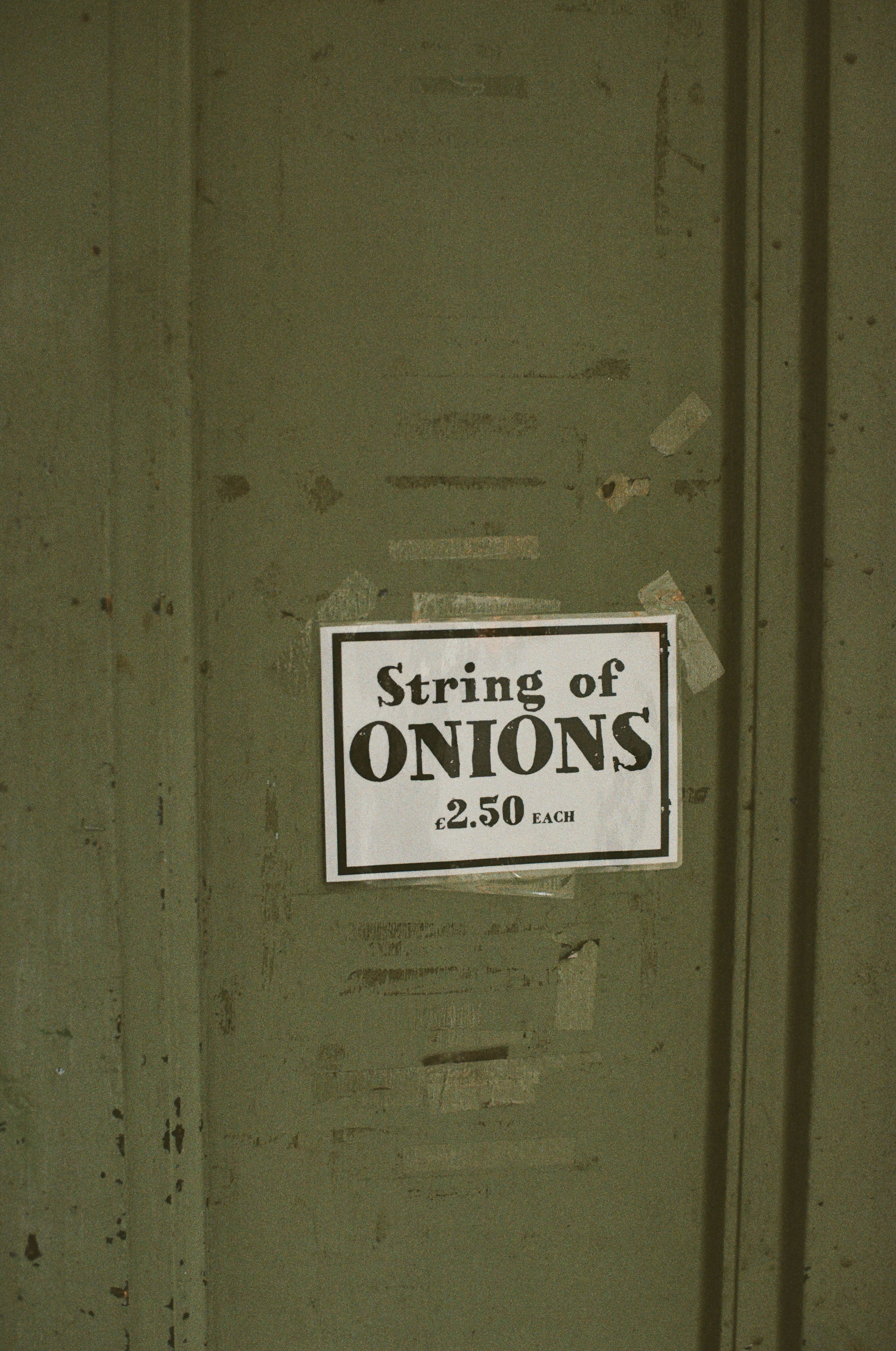 Sign for string of onions priced at 2.50