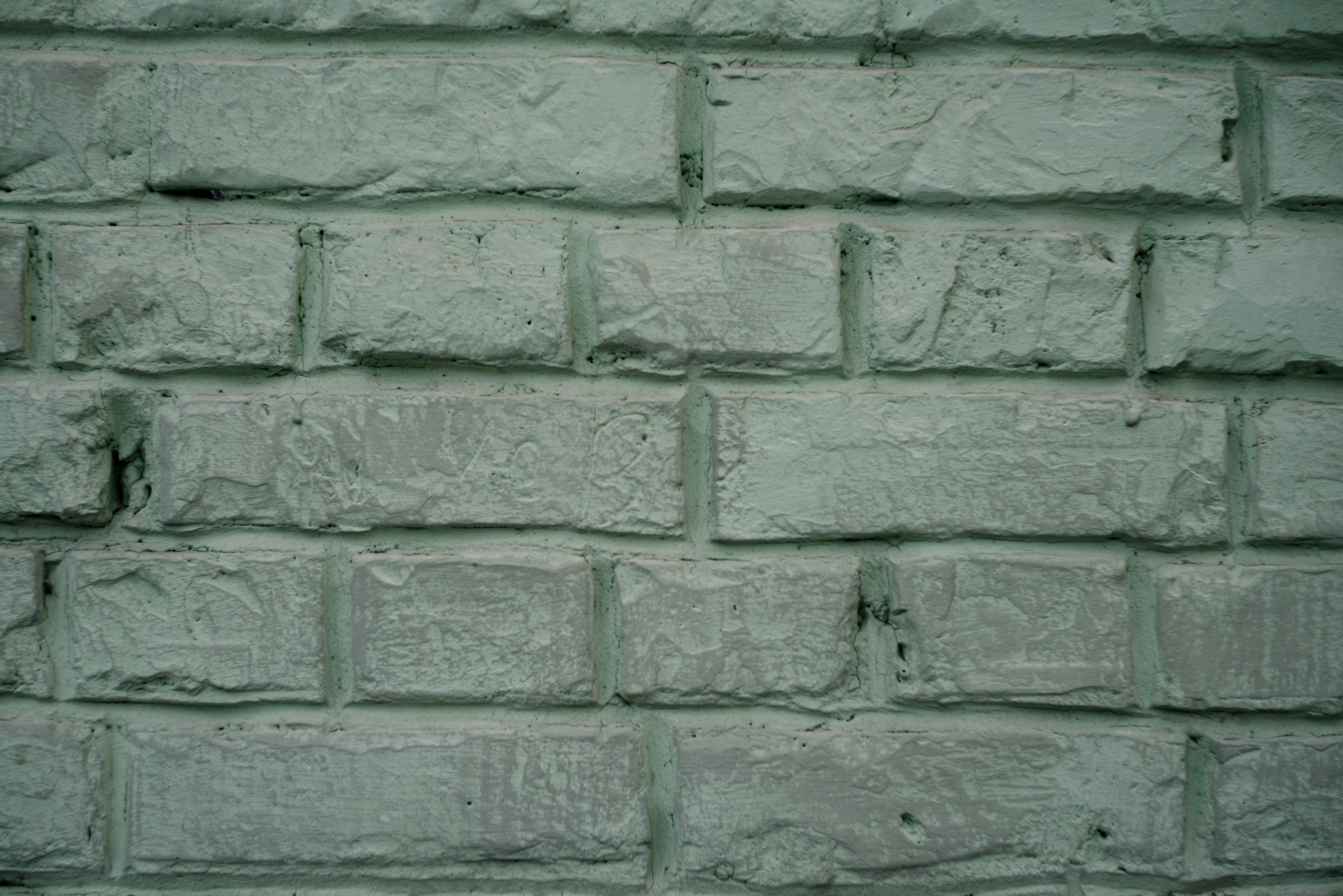 A light green painted brick wall texture