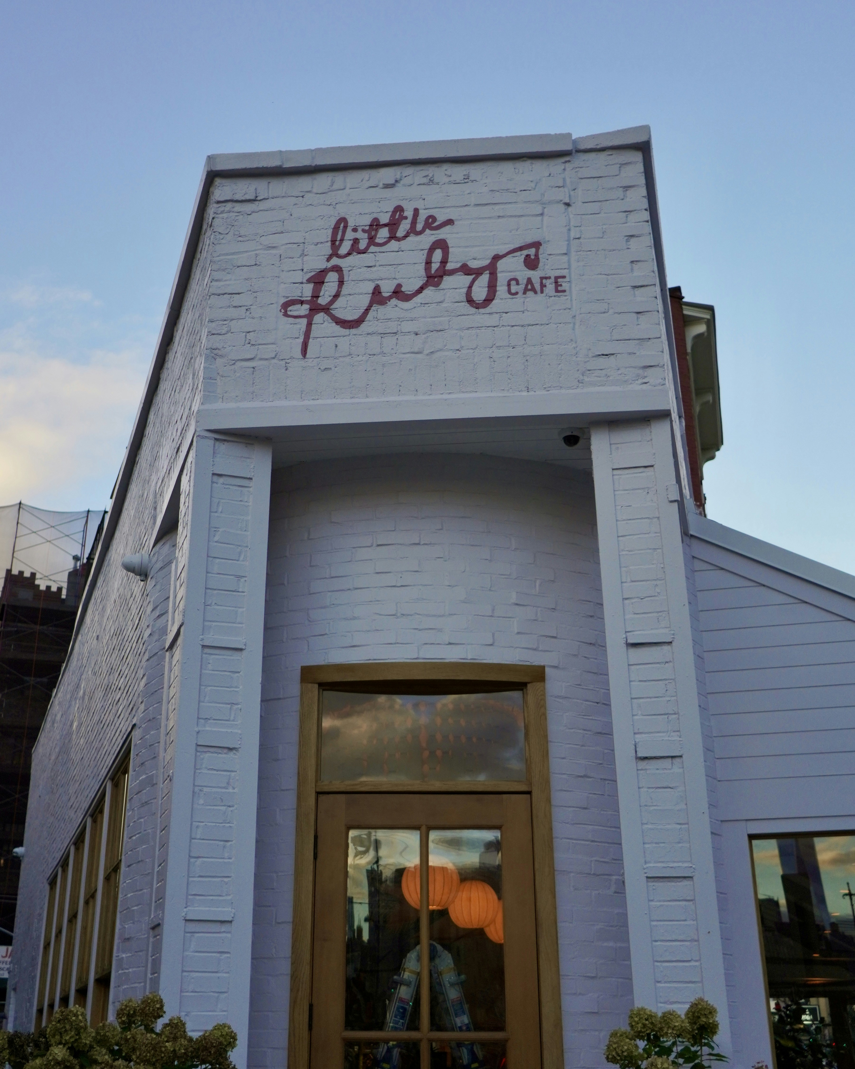 Little ruby's cafe building exterior with signage.