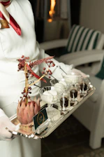 Server offers a tray of desserts and coffee