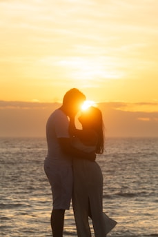 Couple embracing at sunset on the ocean