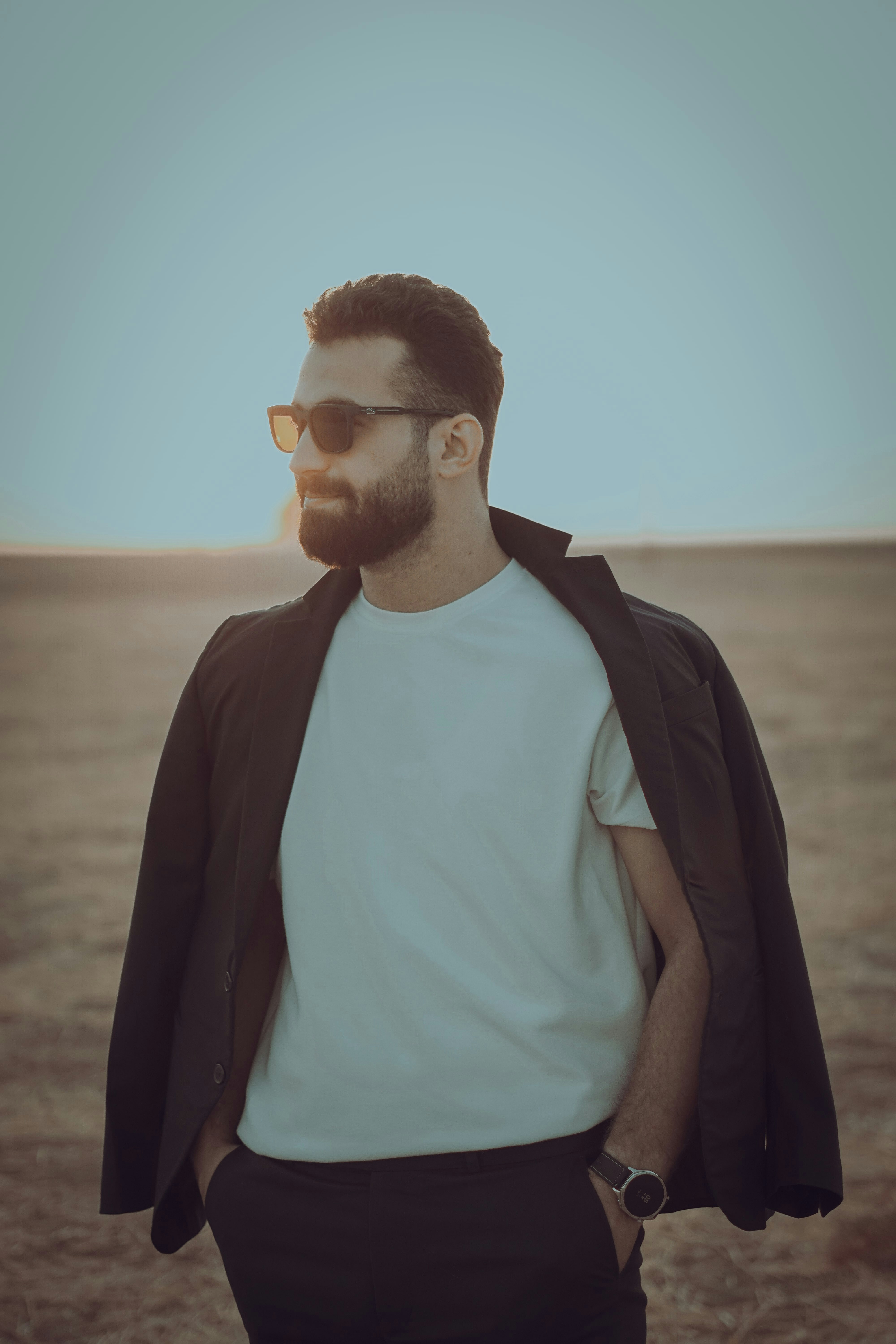 Man in sunglasses and jacket outdoors