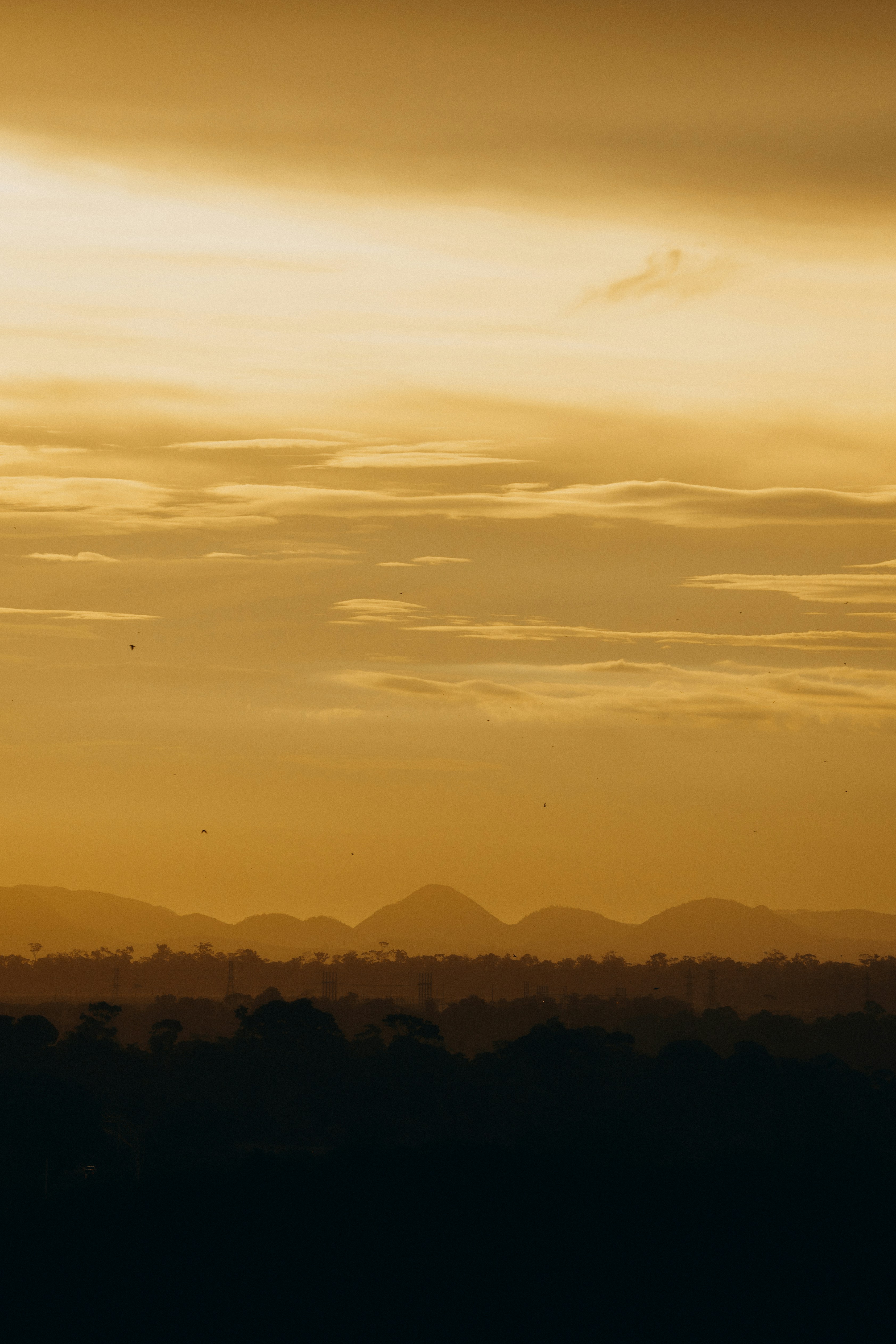 Golden sunset over distant mountain ranges