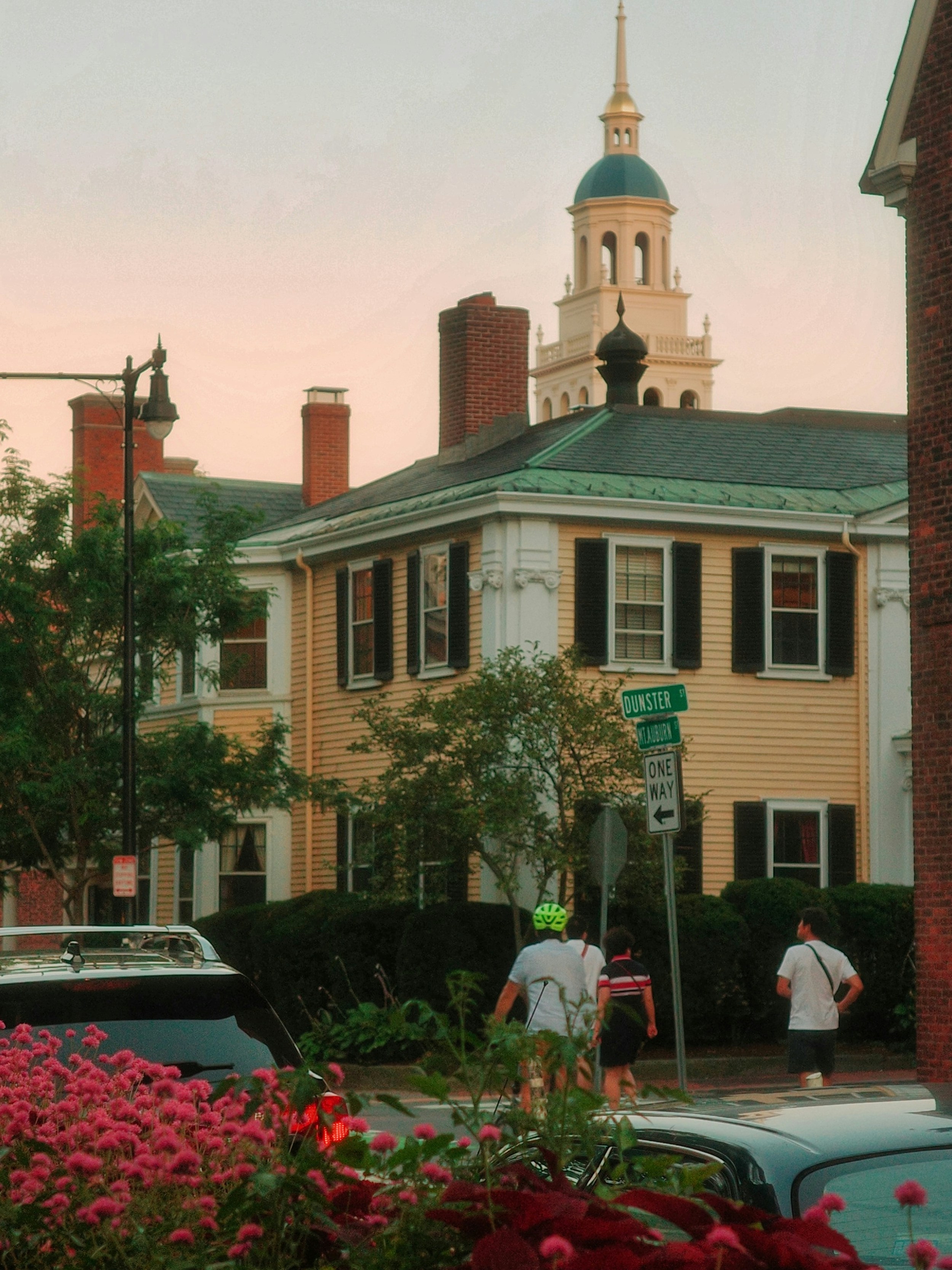 Yellow building with a domed tower at sunset.