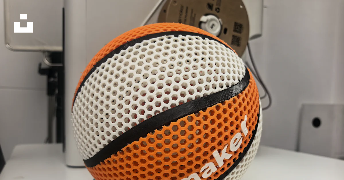 3D-printed basketball displayed on a stand