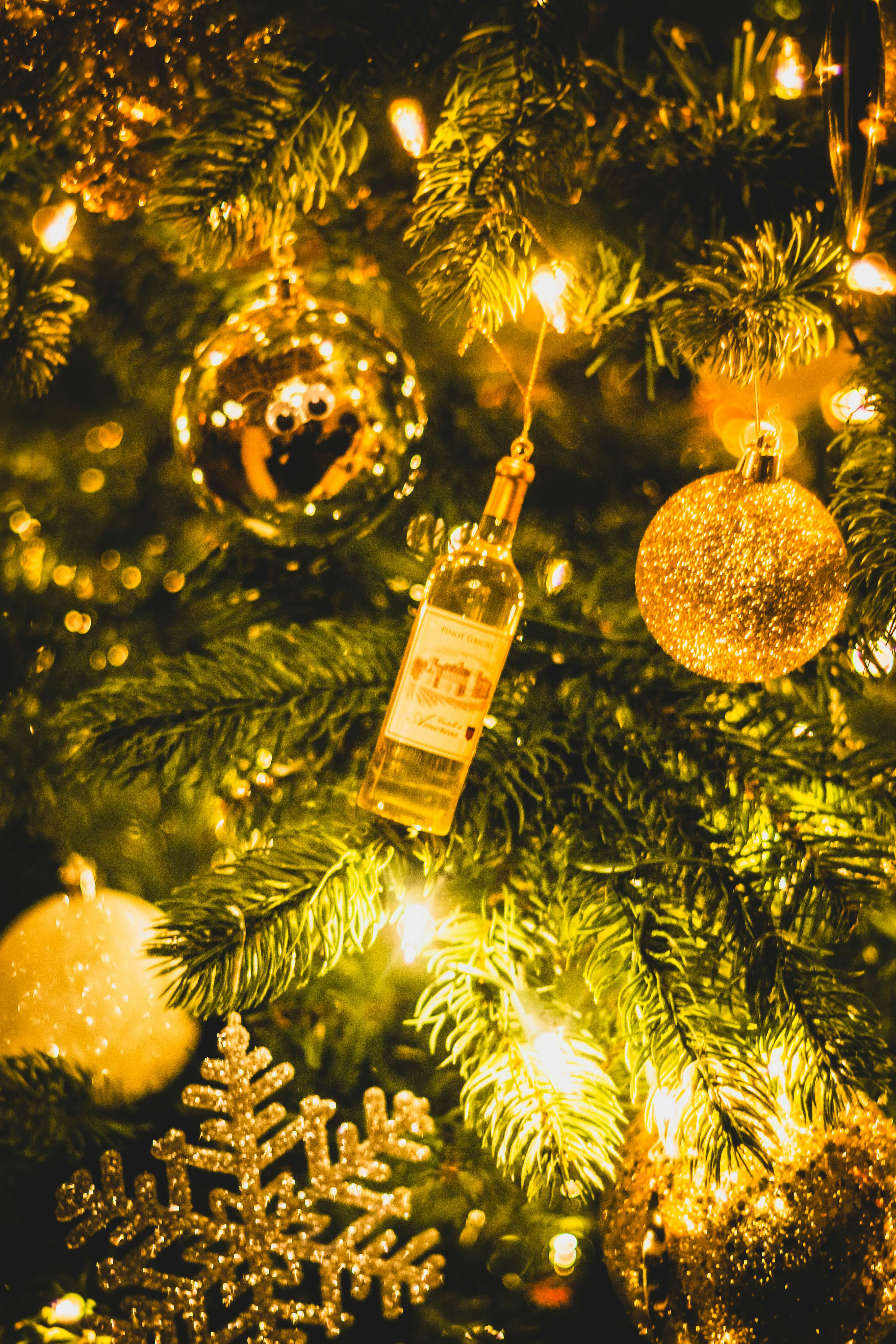 Close up of christmas tree ornaments and lights