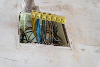 Electrical wires connected with yellow terminal blocks.