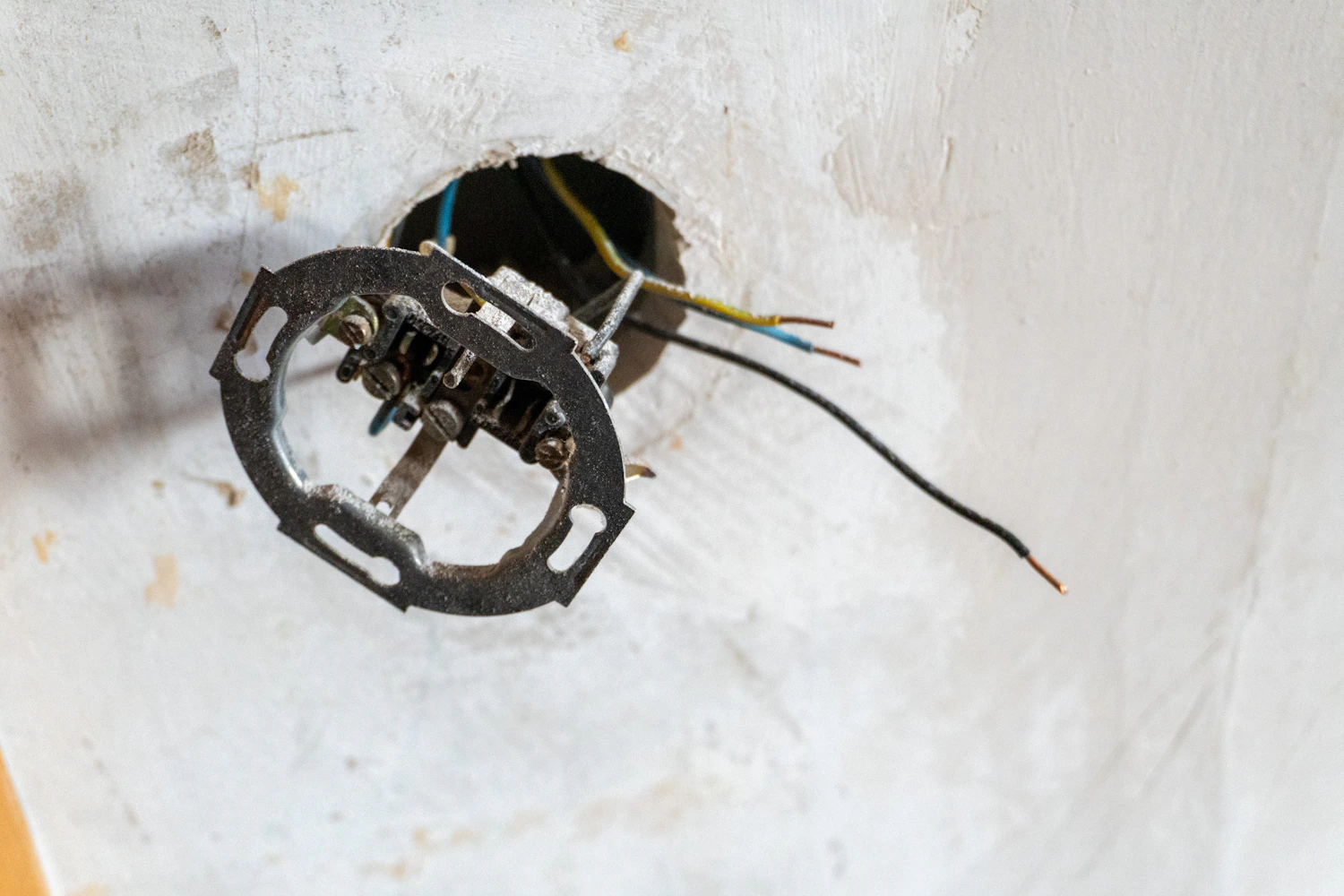 Exposed electrical wires during renovation illustrating electrical safety risks