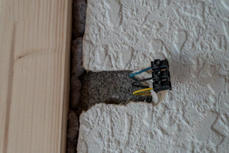 Exposed electrical wires in a textured wall opening