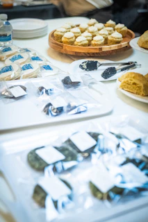 Assortment of baked goods and snacks on a table.