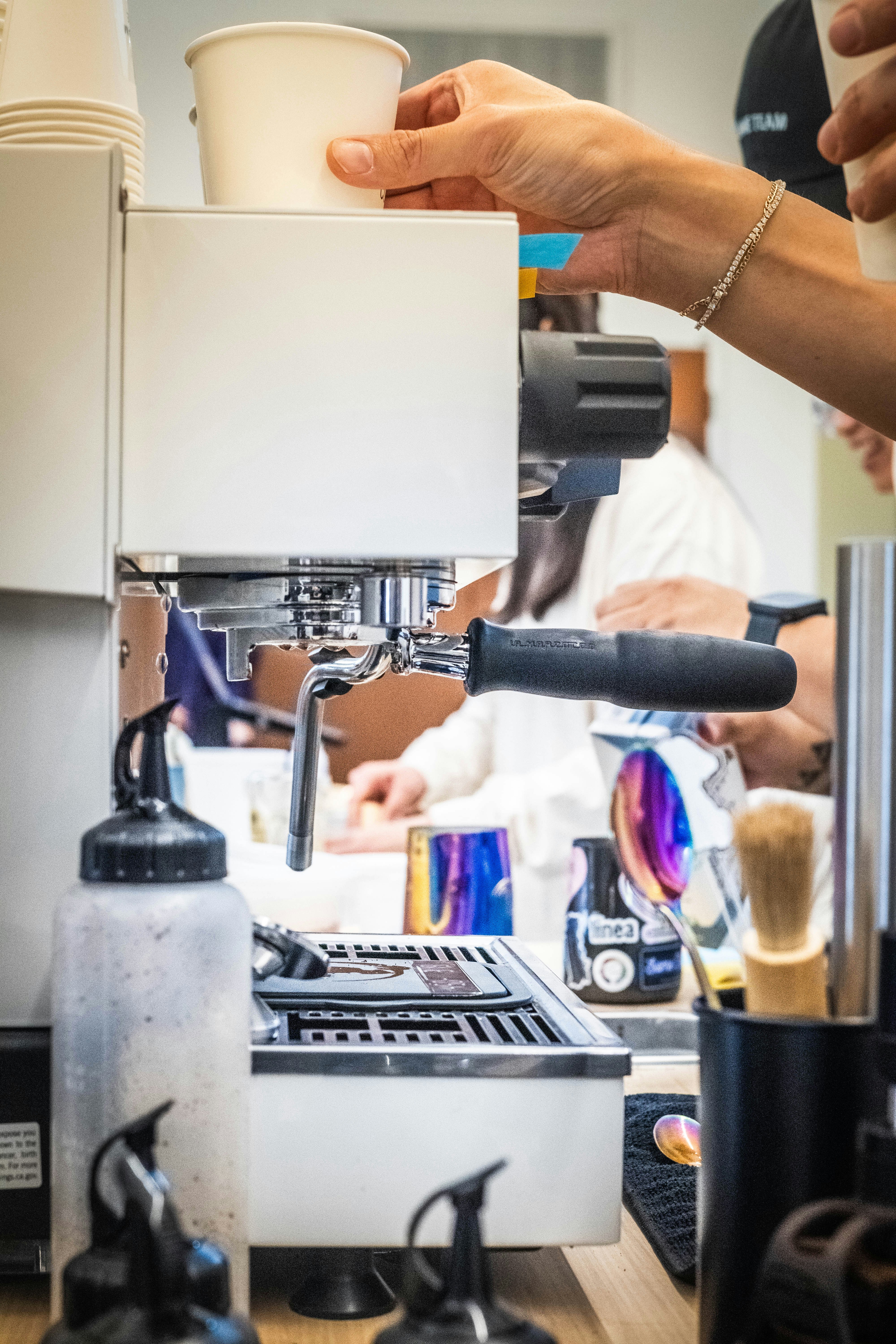 Barista preparing coffee with espresso machine