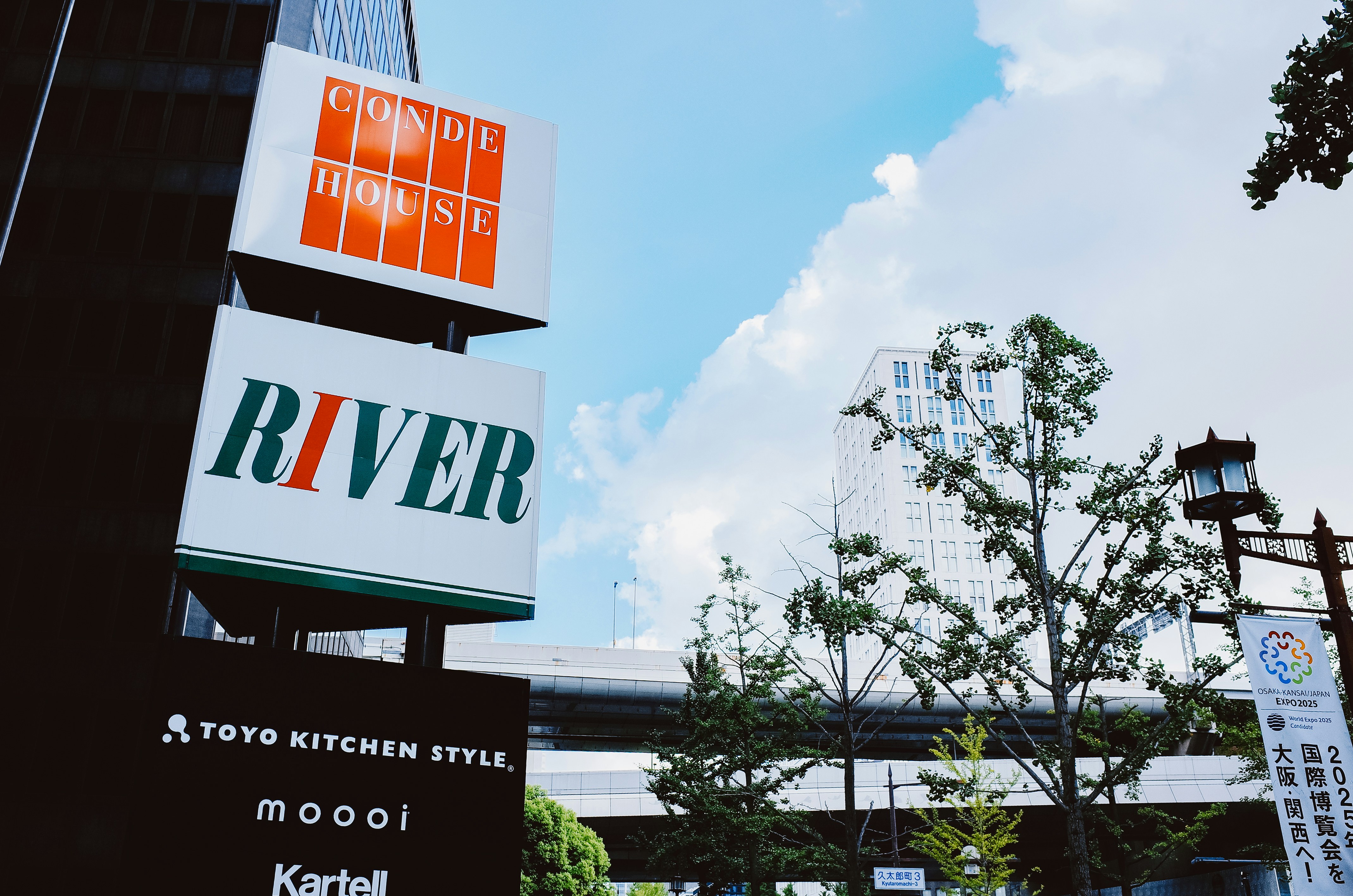 Signs for conde house, river, and other brands.