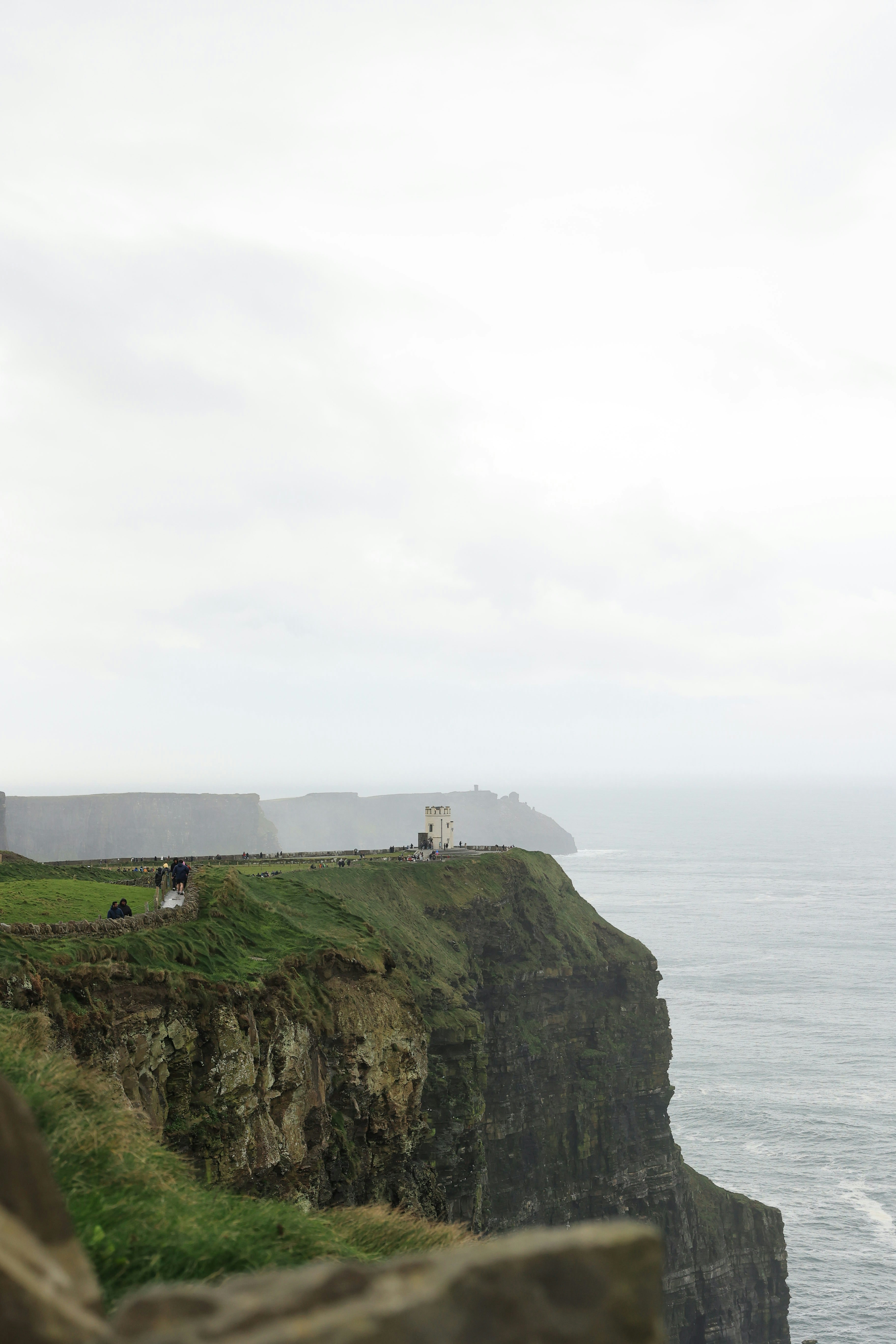 Cliffs of moher with a small tower on top