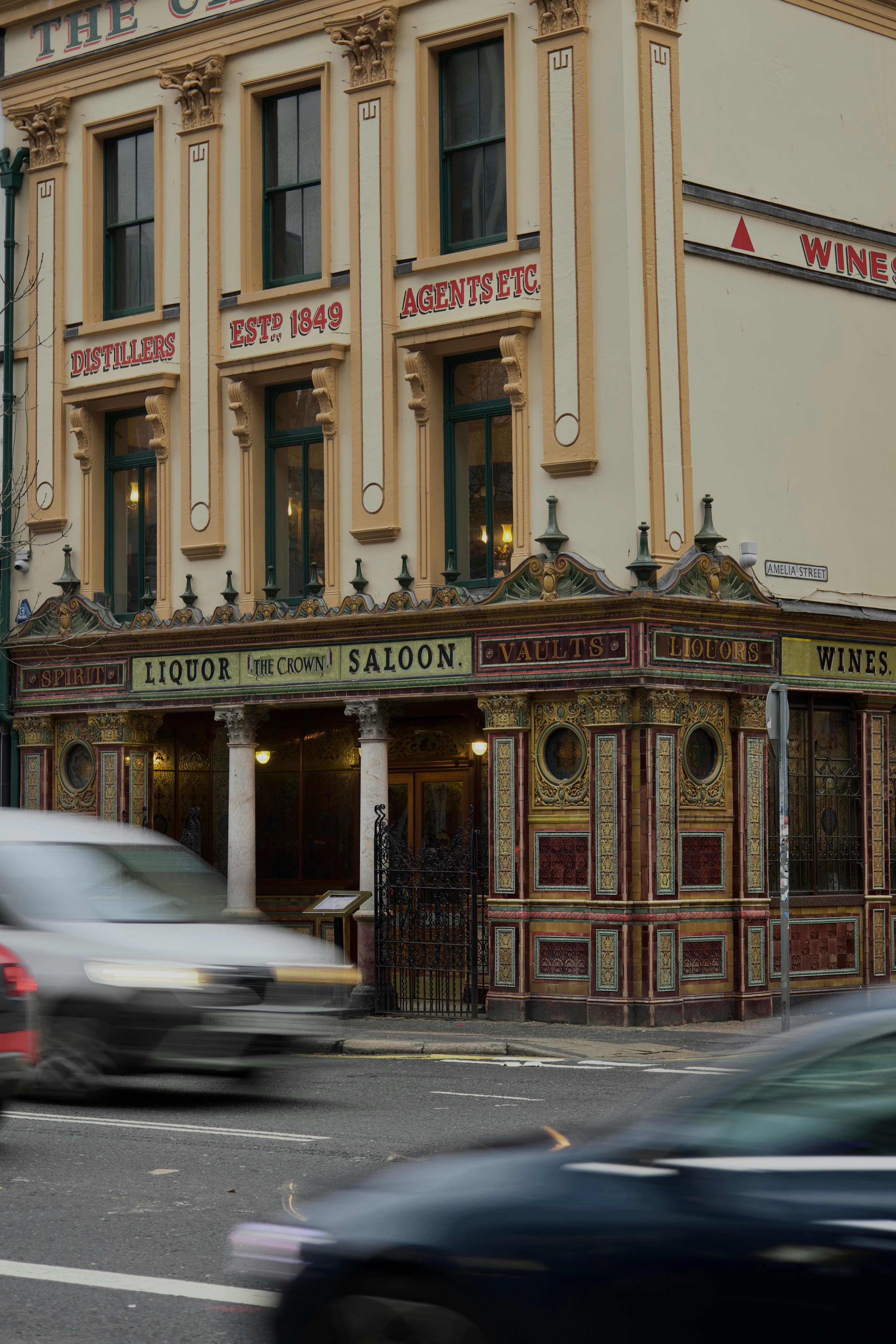 Historic pub with cars passing by