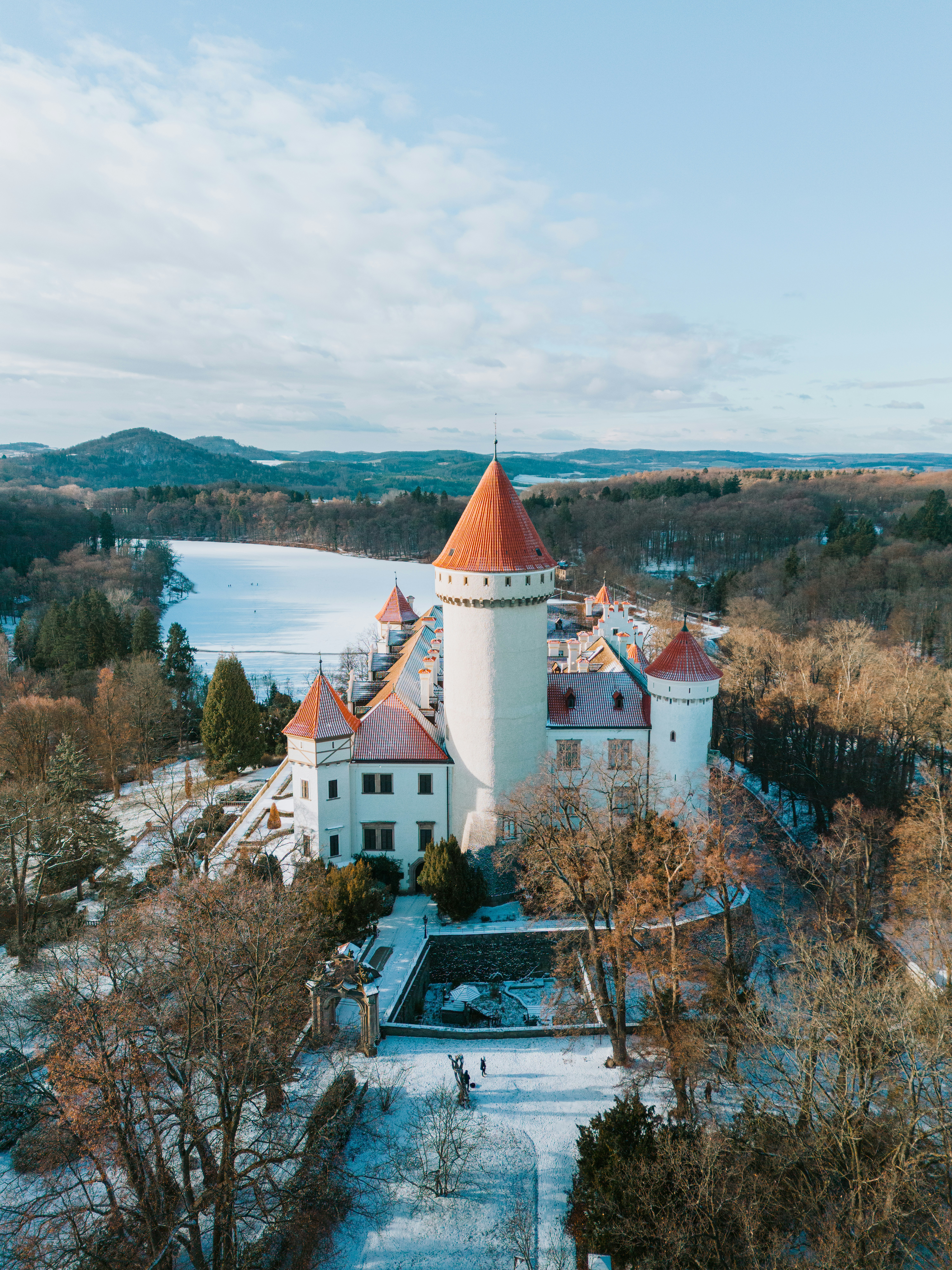Fairytale castle surrounded by snowy winter landscape