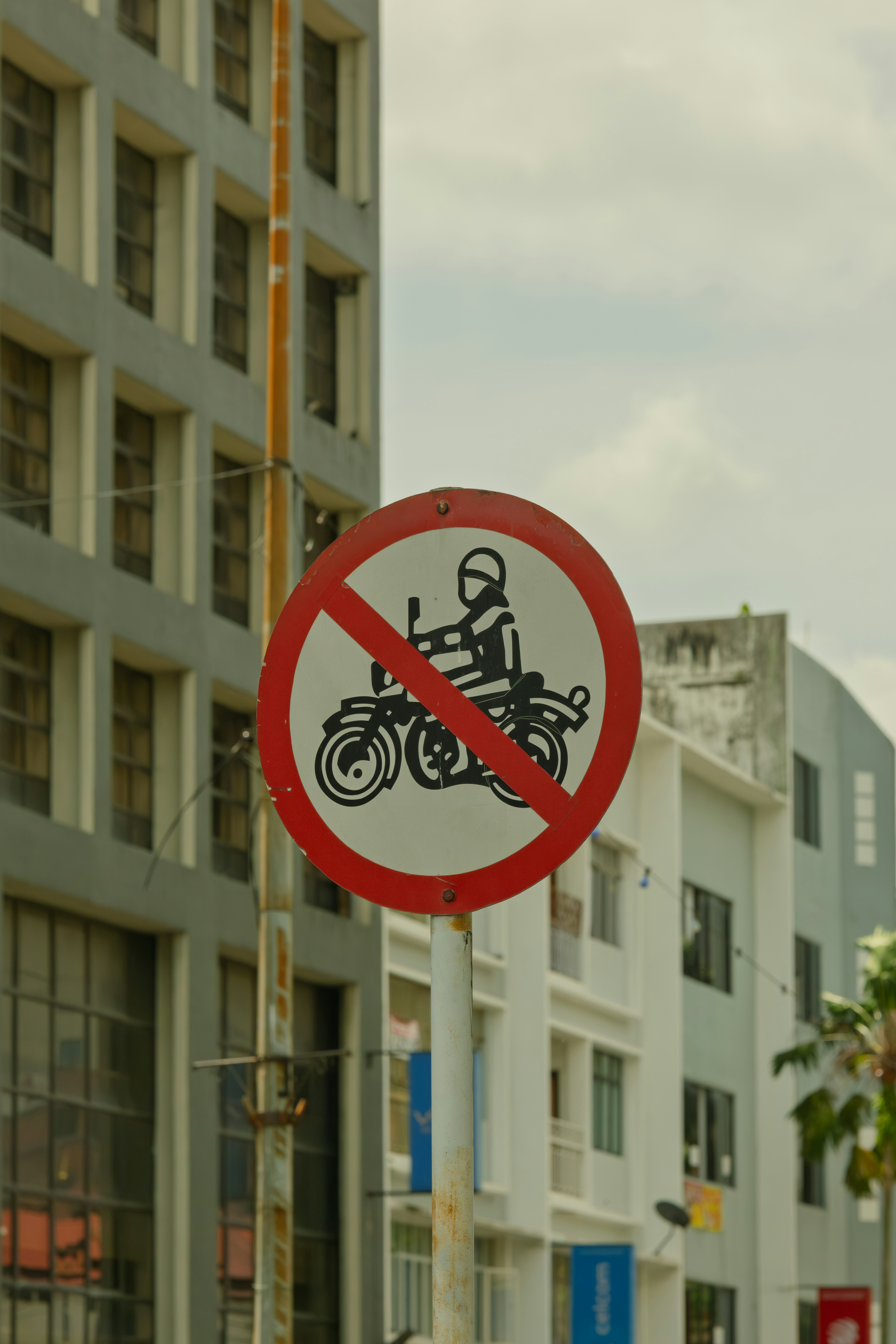 No motorcycles allowed sign on pole