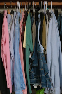 A closet full of neatly hung clothes.