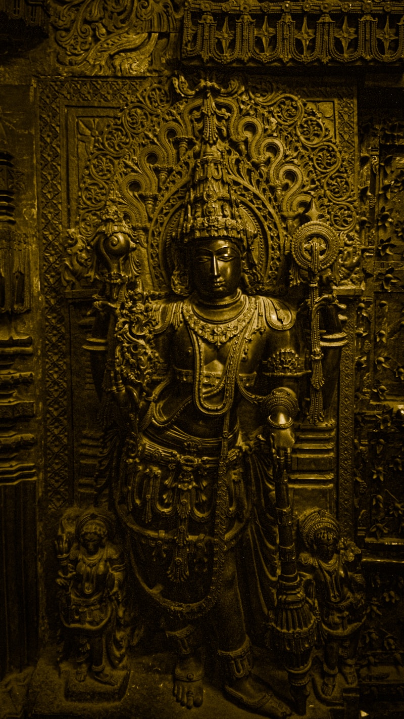 Intricate stone deity carving