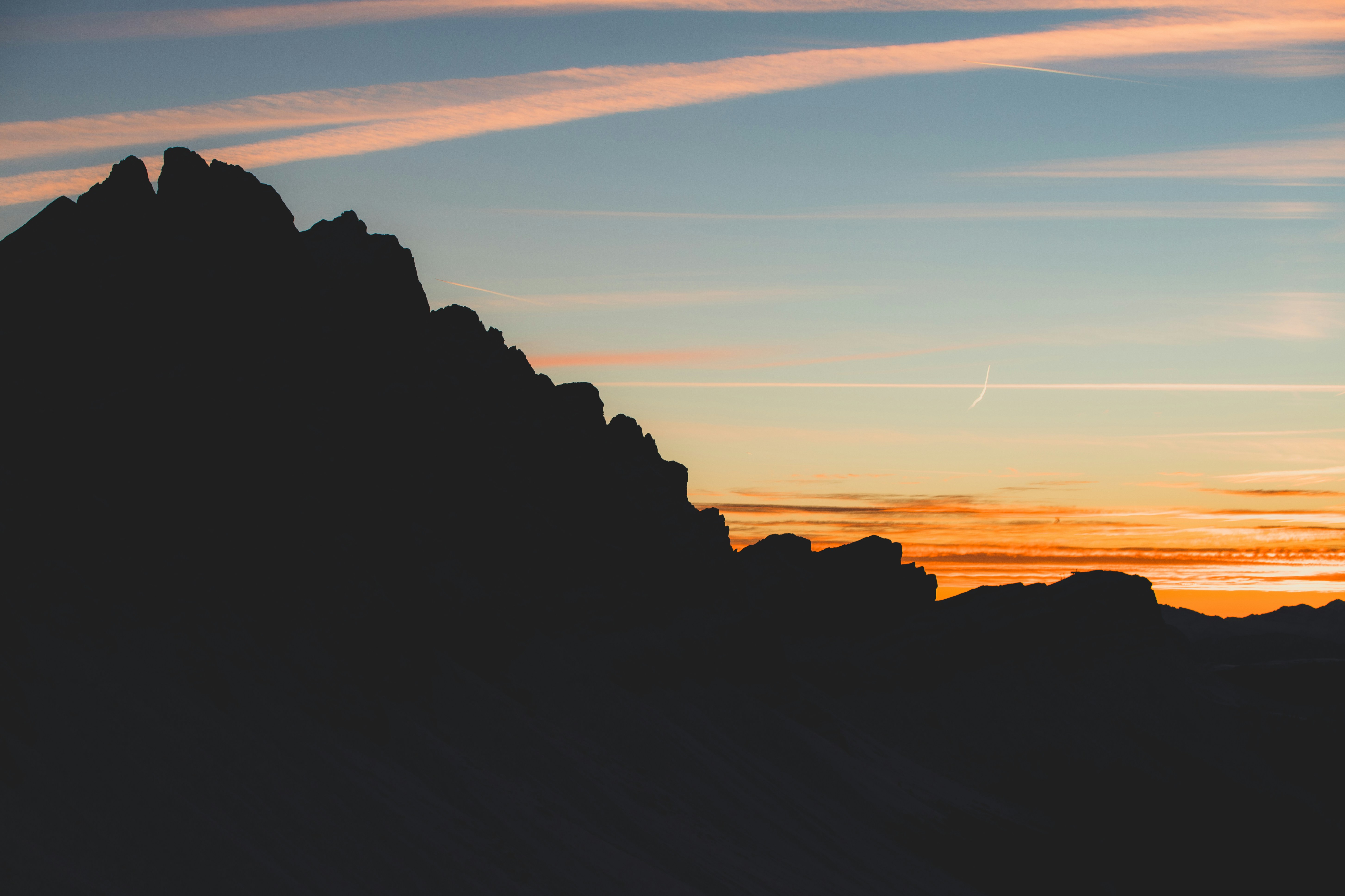 Silhouette of a mountain range at sunset