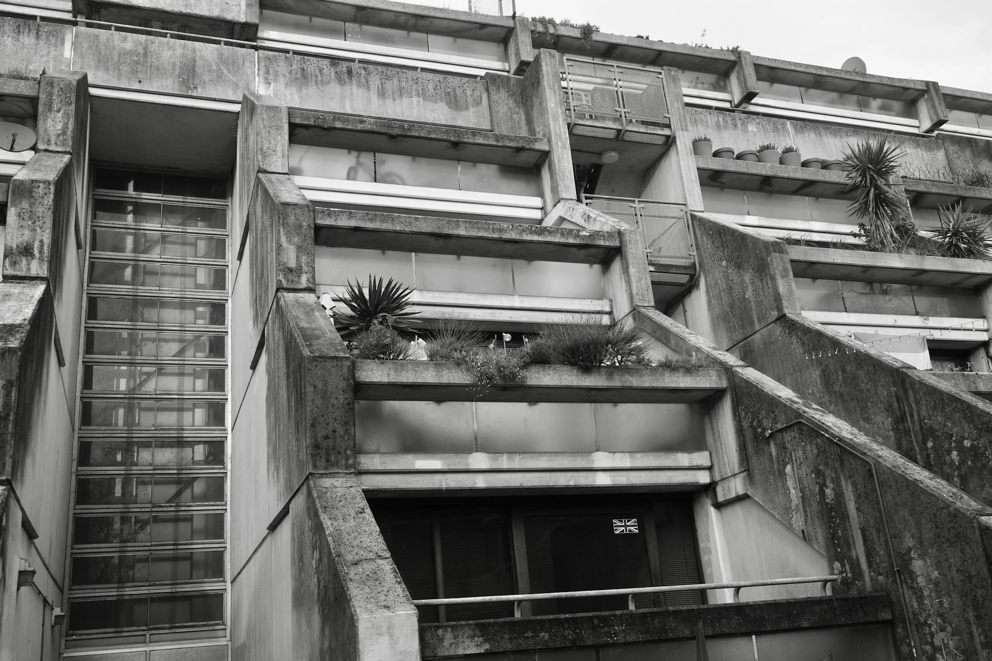 Brutalist concrete architecture with intersecting stairs and balconies