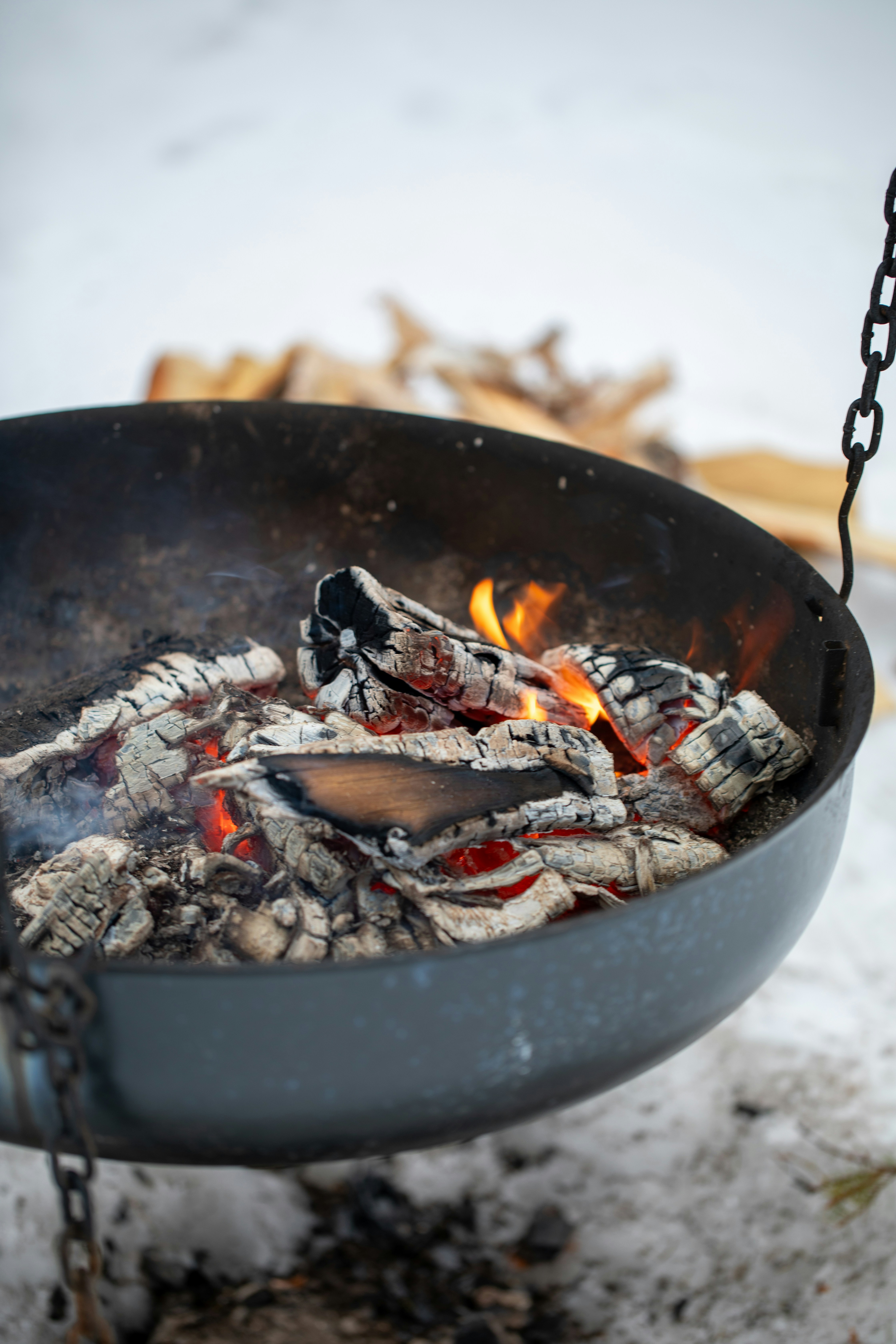 Fire burning in a metal bowl outdoors