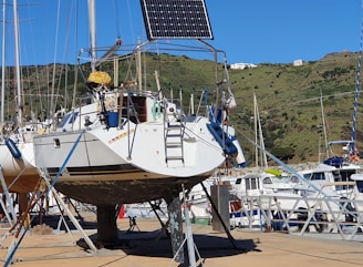 Sailboat with solar panel on a stand.