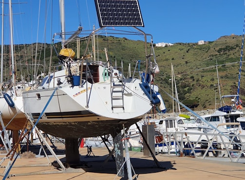 Sailboat with solar panel on a stand.