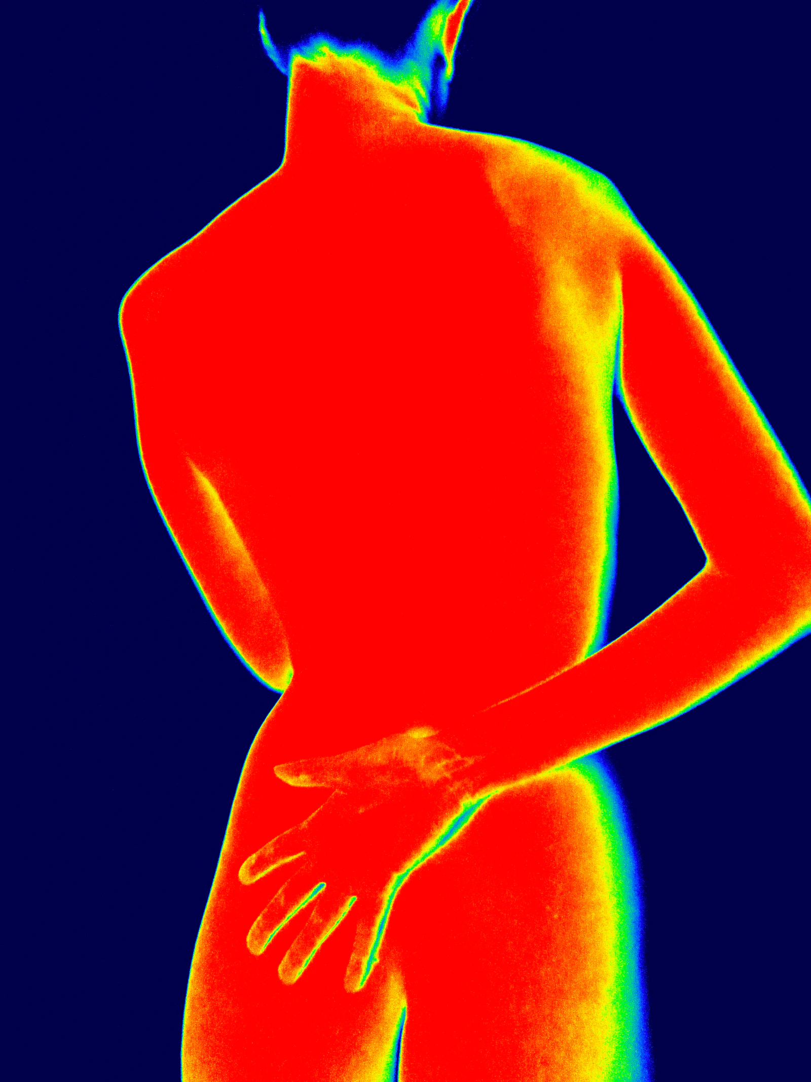 Thermographic view of a person's back and arm.