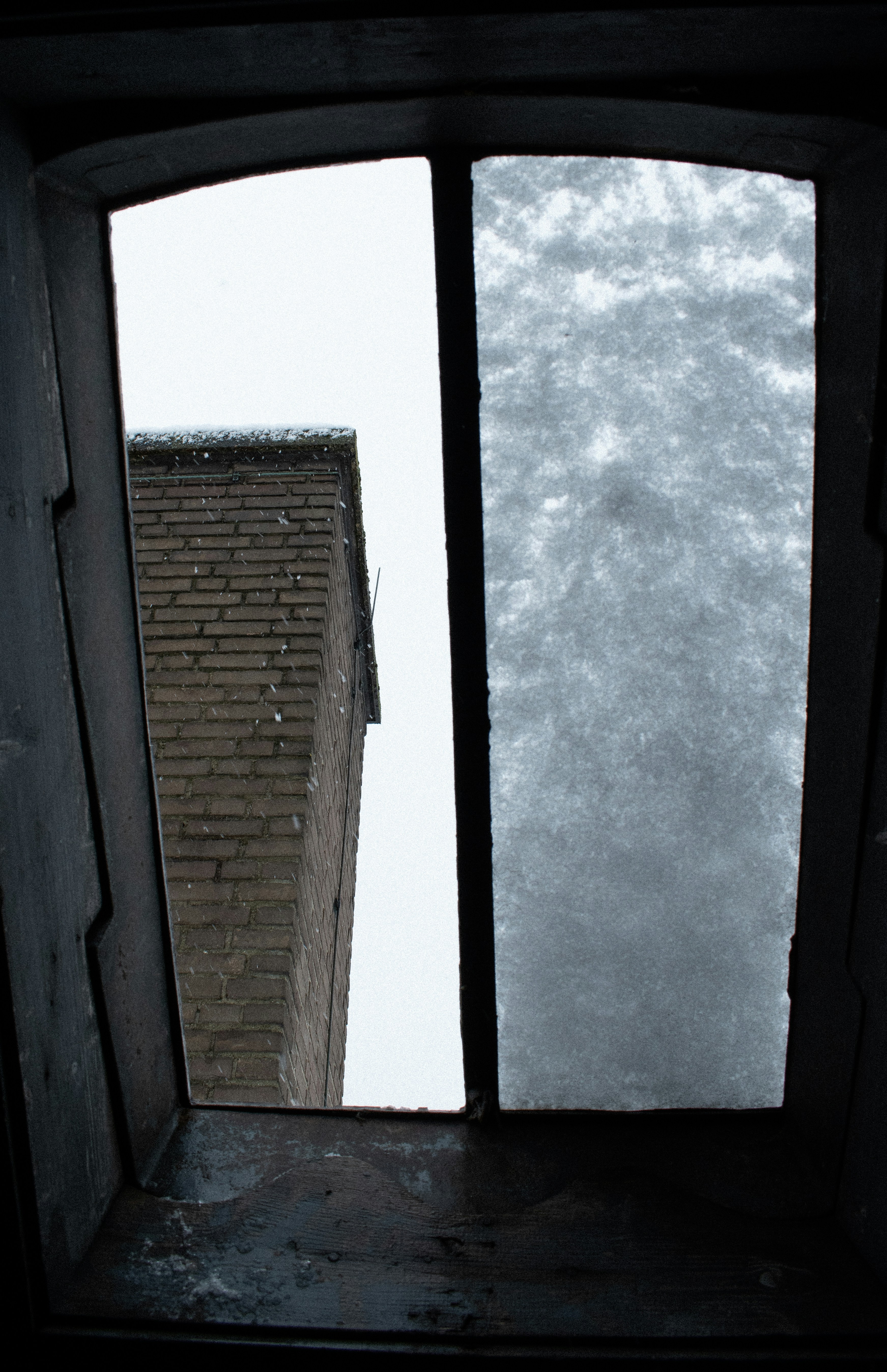 View through a window with snow on the glass.