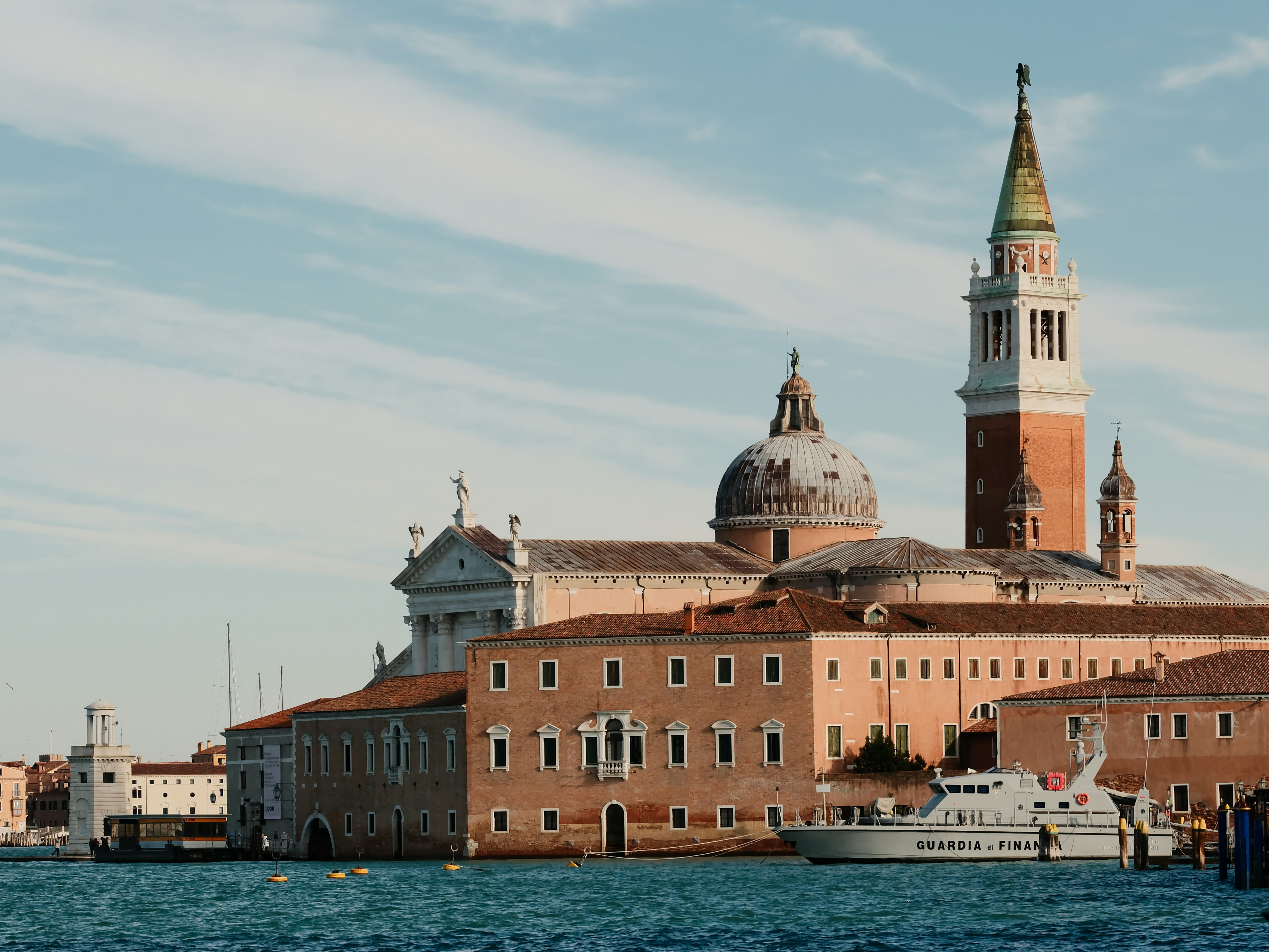 Venetian buildings with a boat on the water.