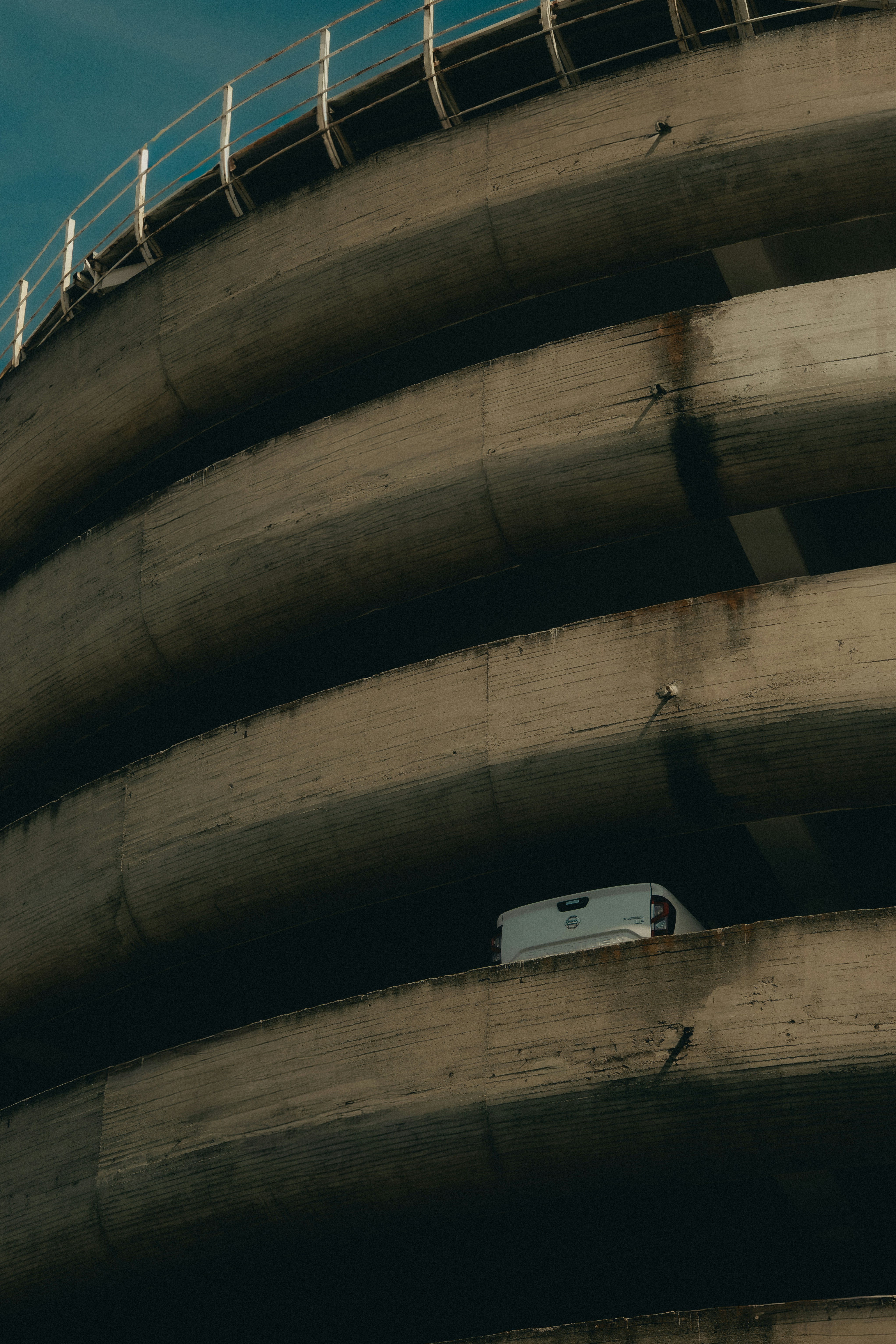 White van on a concrete parking ramp