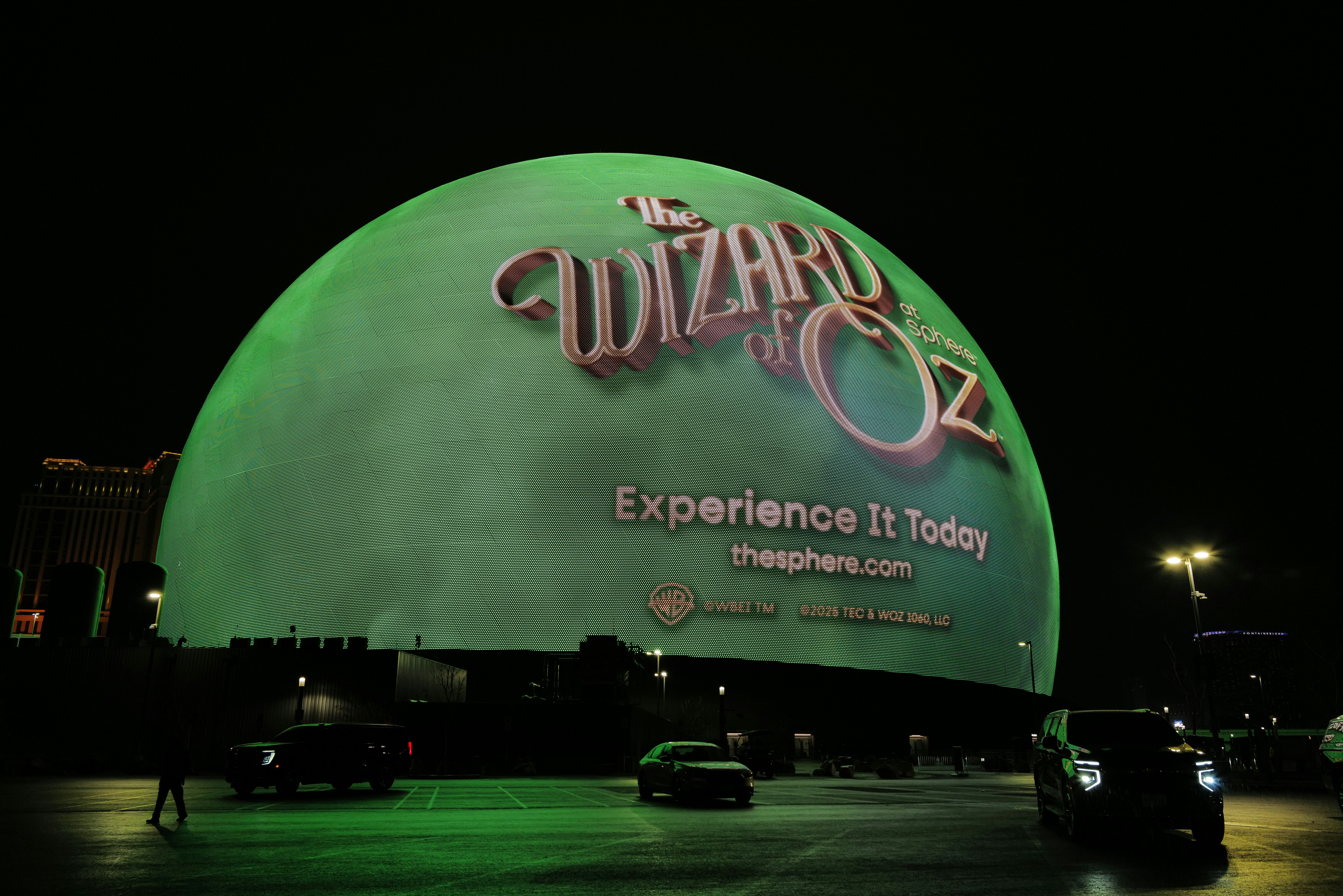 The sphere at night with wizard of oz advertisement