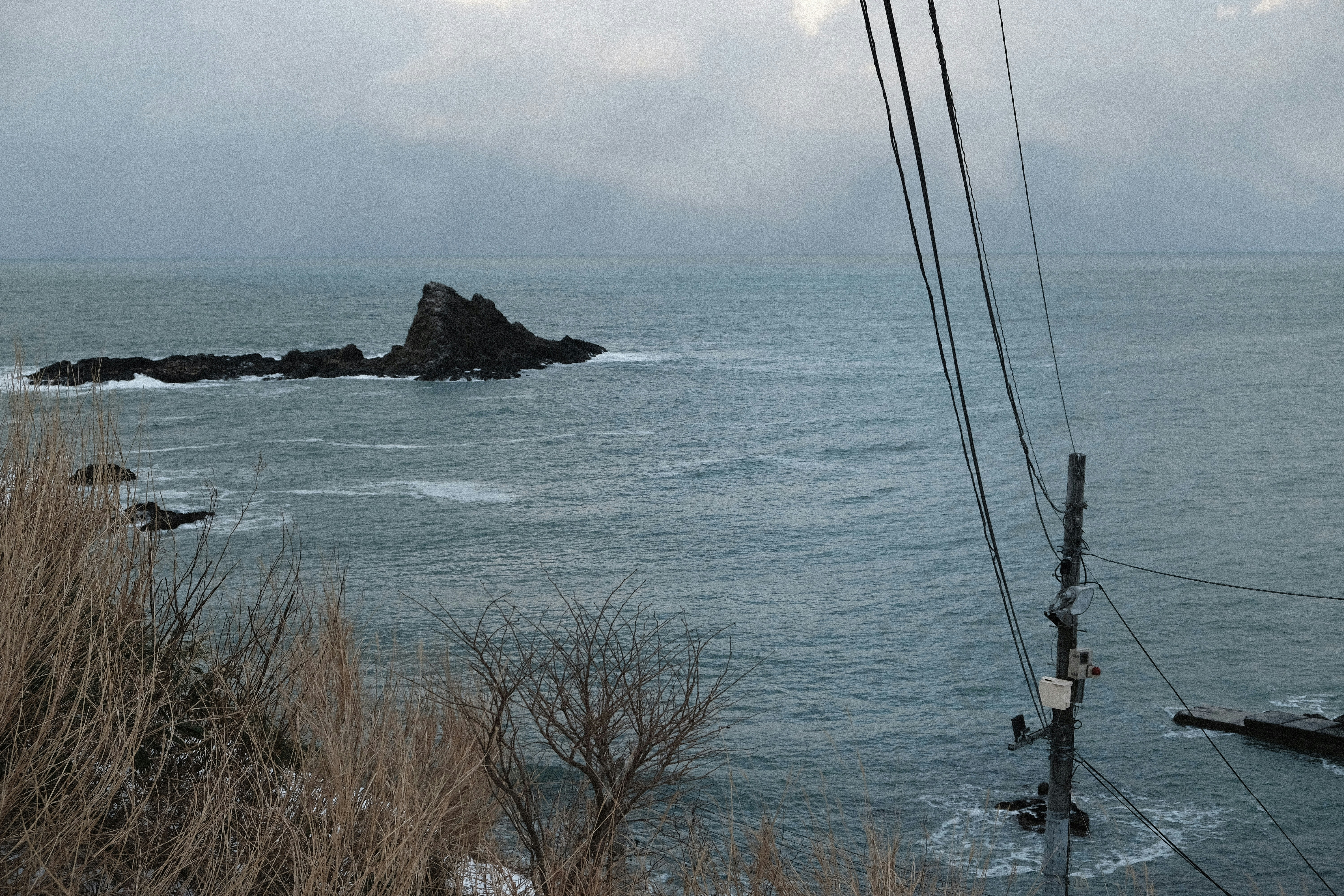 Rocky island formation in a choppy sea