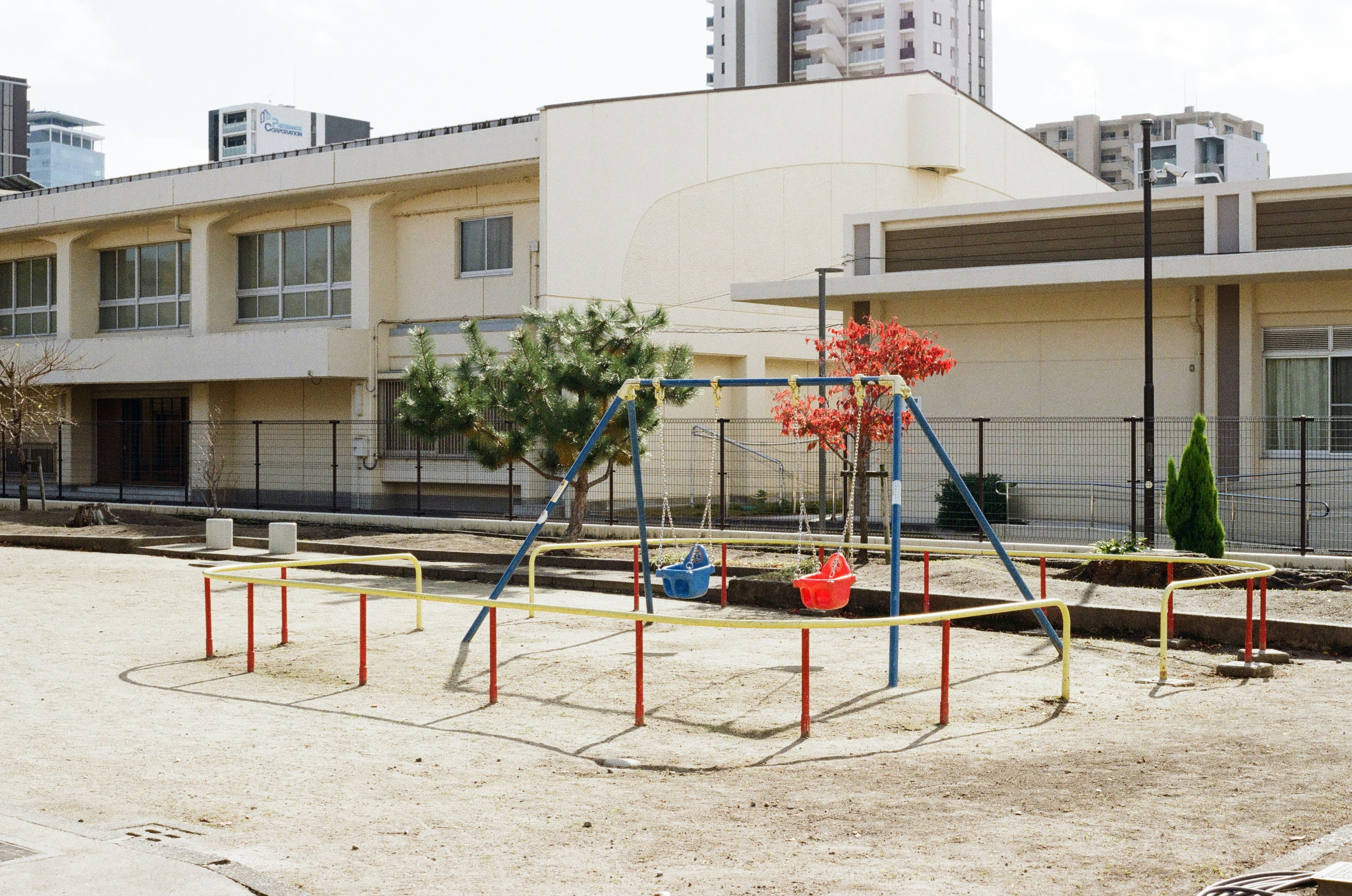 Playground equipment in front of school building